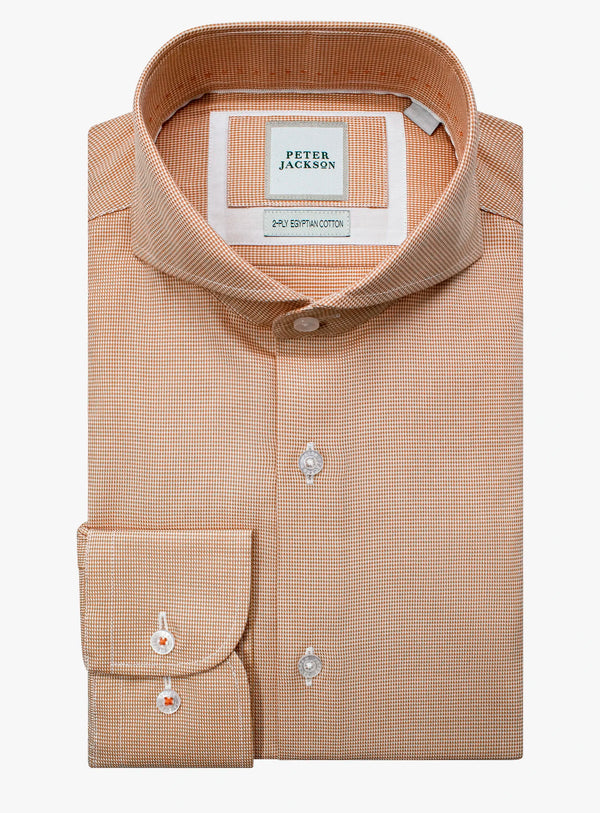 Beige checkered dress shirt with brand label on a white background