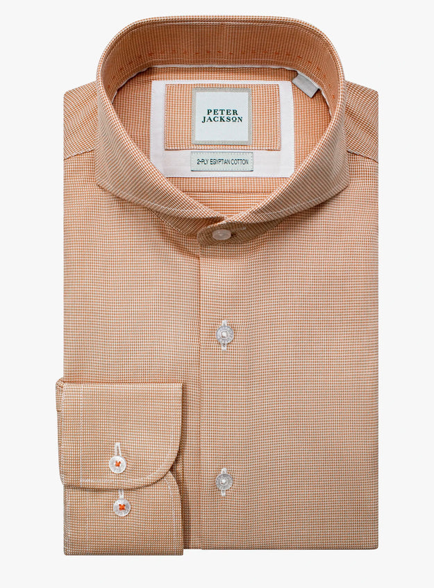 Beige checkered dress shirt with brand label on a white background