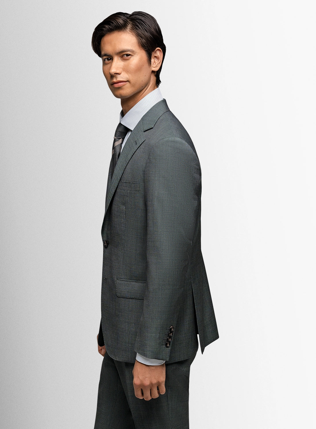 Man wearing a gray suit on a white background