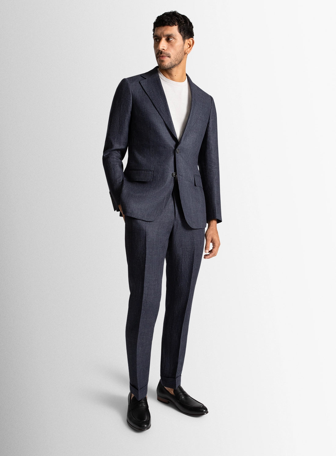 Man wearing a gray suit on a white background