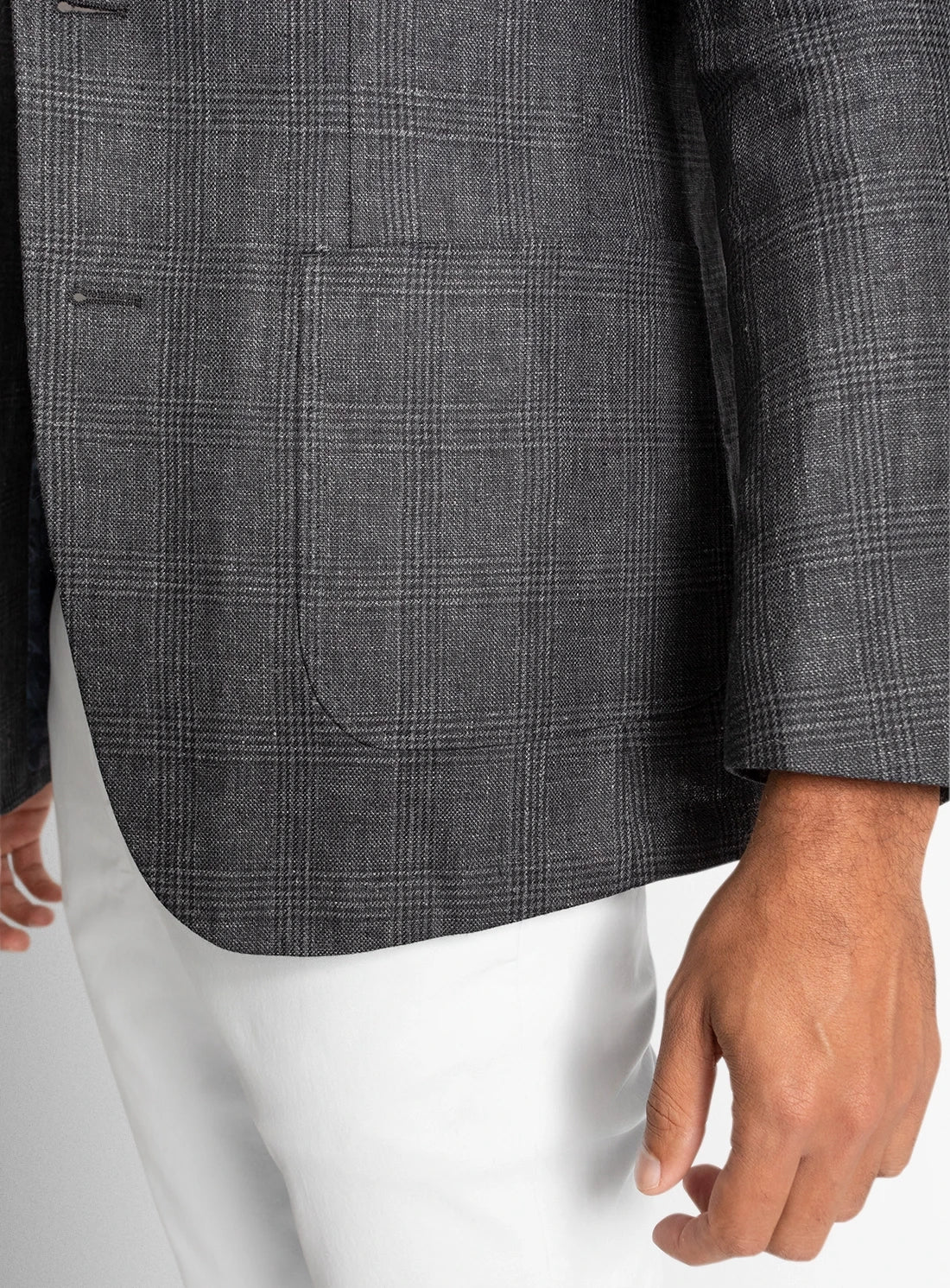 Gray checkered blazer worn by a person on a light gray background
