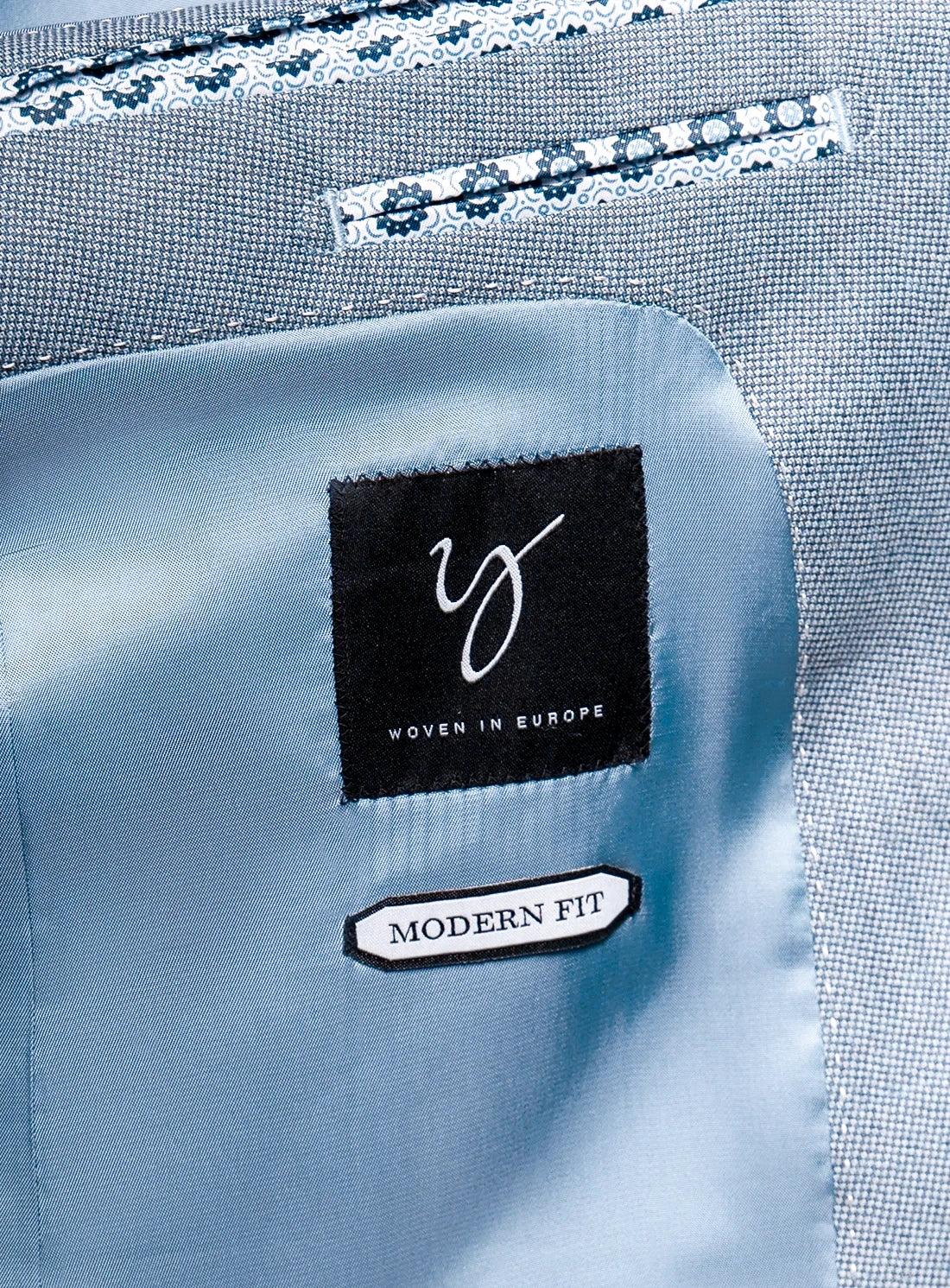 Close-up of a blue shirt with a brand label and 'Modern Fit' tag.
