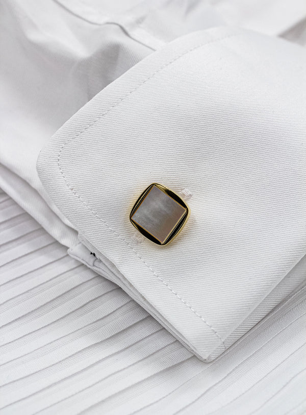 square gold with mother of pearl cufflinks in shirt