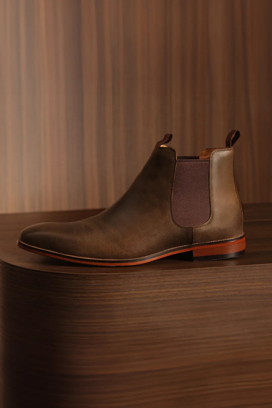Chelsea Boot sitting over a wooden box