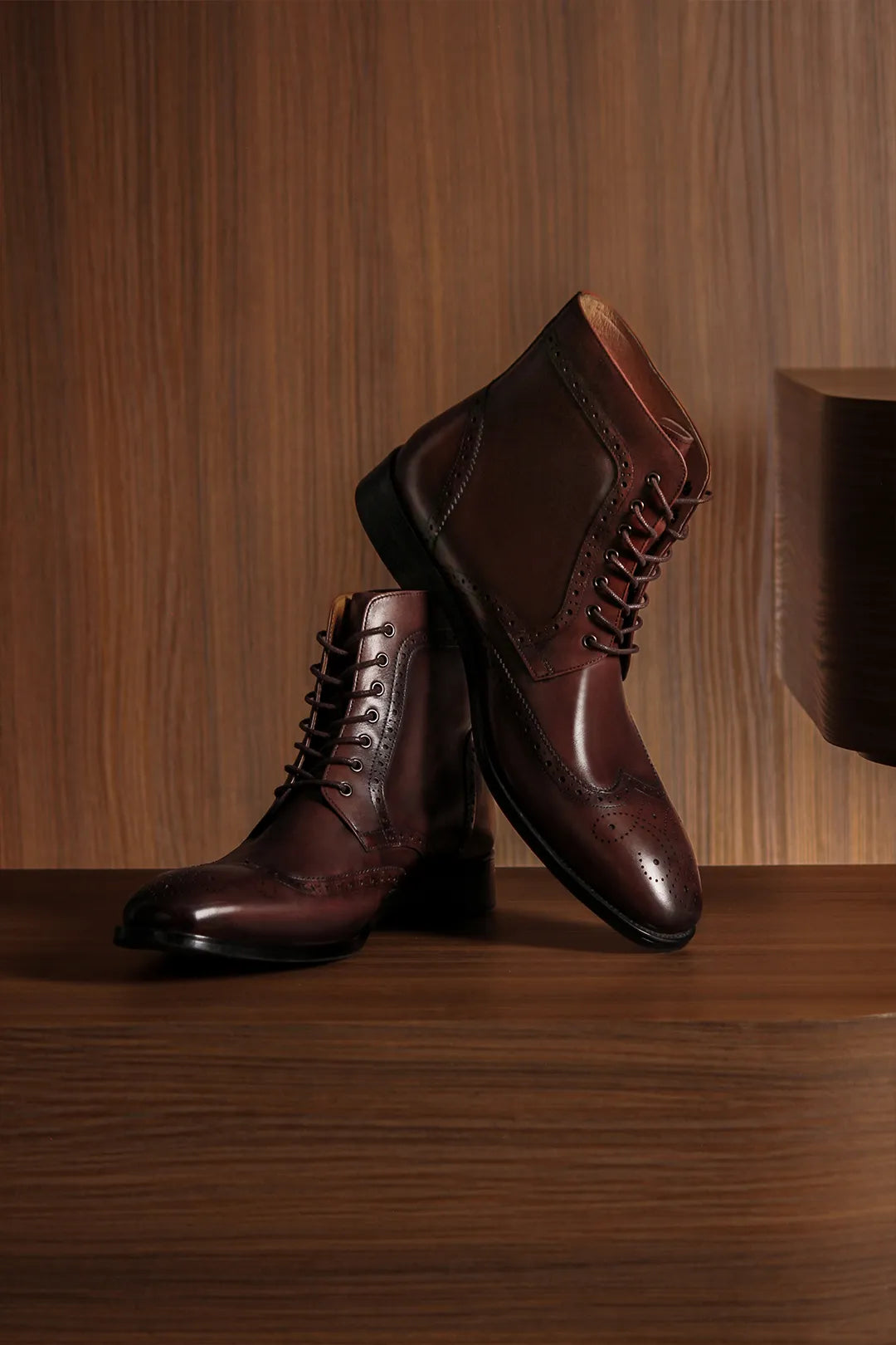 Derby boot sitting over a wooden box