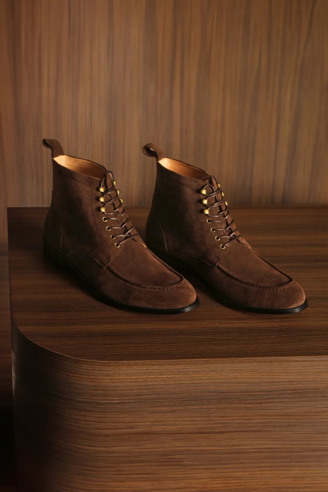 Desert boots sitting over a wooden box