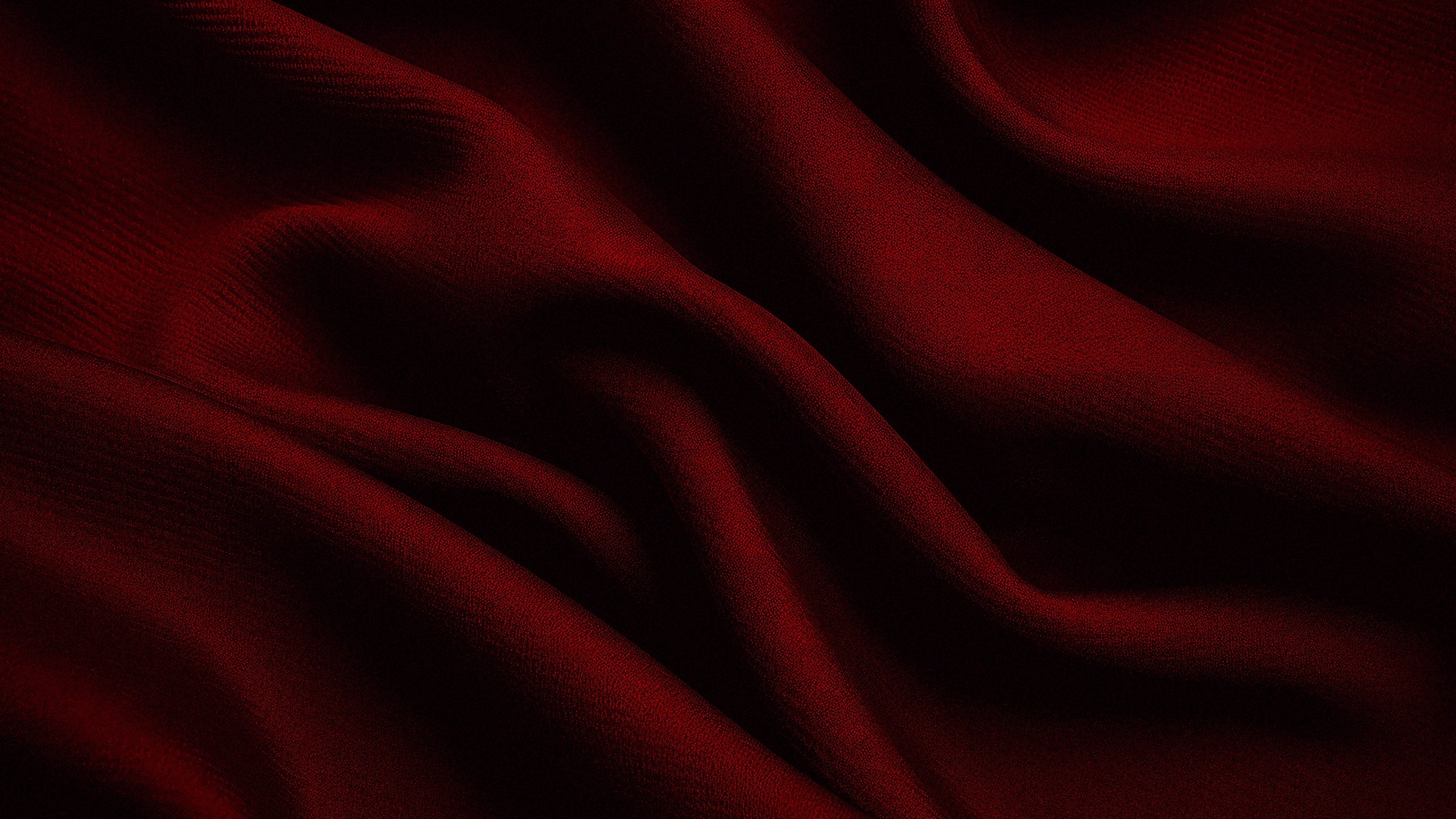 Dark red fabric with folds and shadows