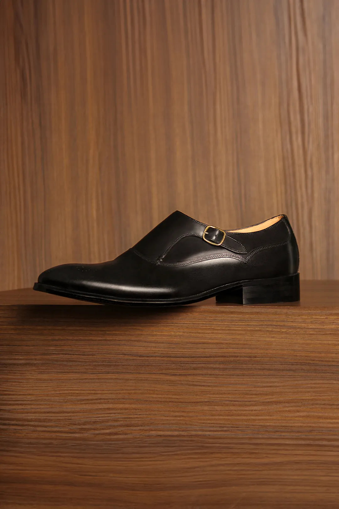 Monk strap sitting over a wooden box