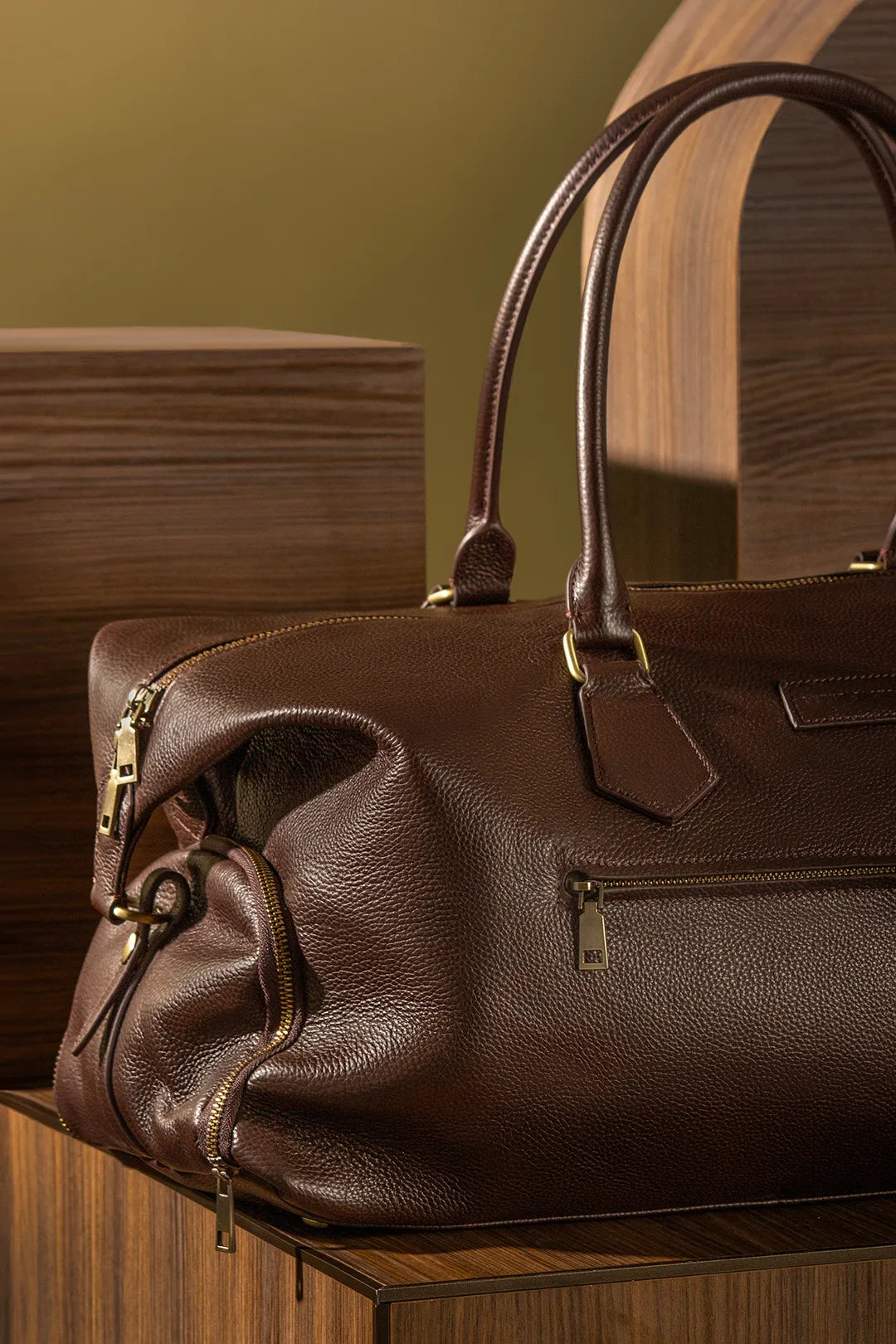 Leather bag sitting over a wooden box
