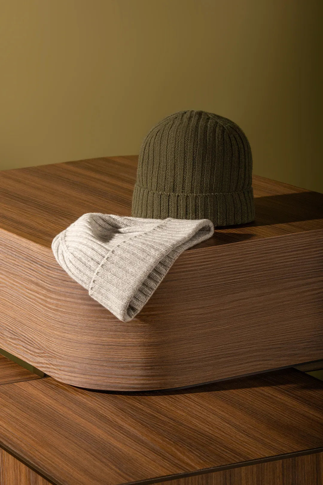 Beanies sitting over a wooden box