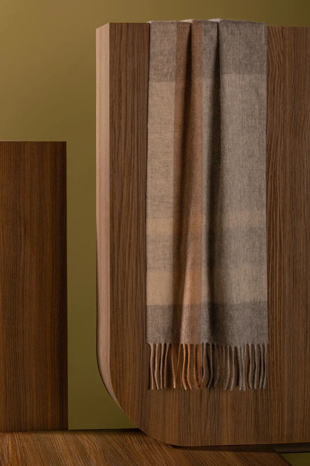 Scarf draped over a wooden box
