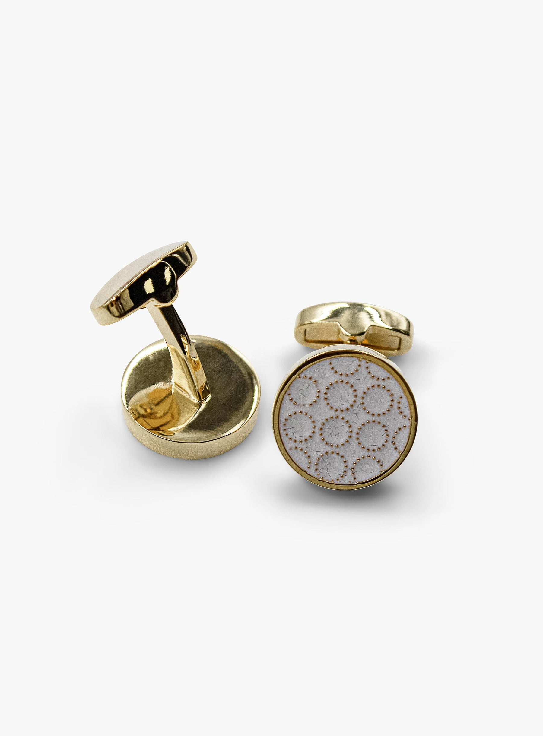 circular gold with white enamel detailed cufflinks