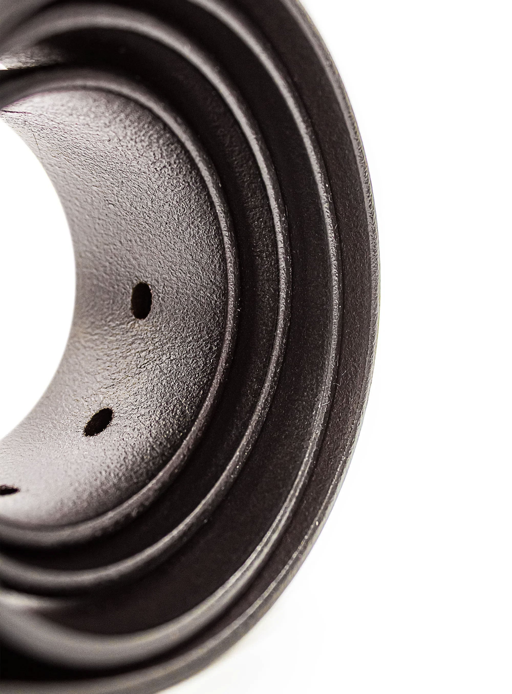 Close-up of a brown leather belt on a white background