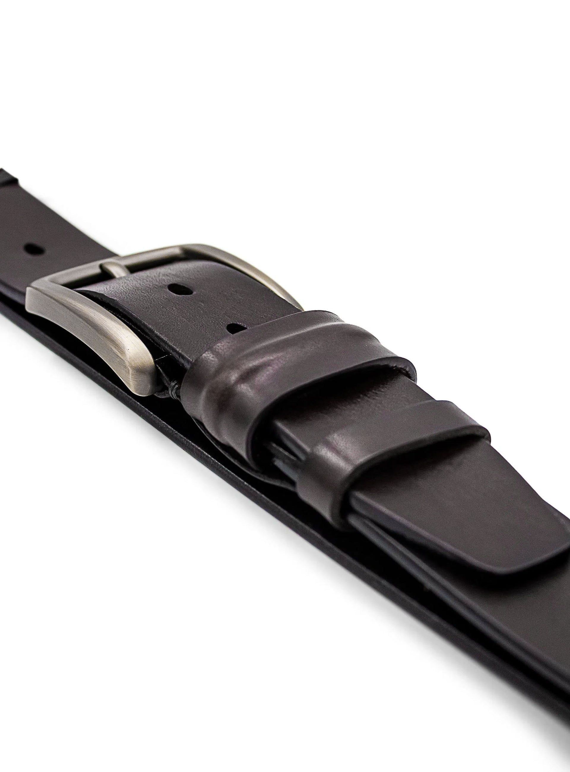 Close-up of a dark brown leather belt with a silver buckle on a white background