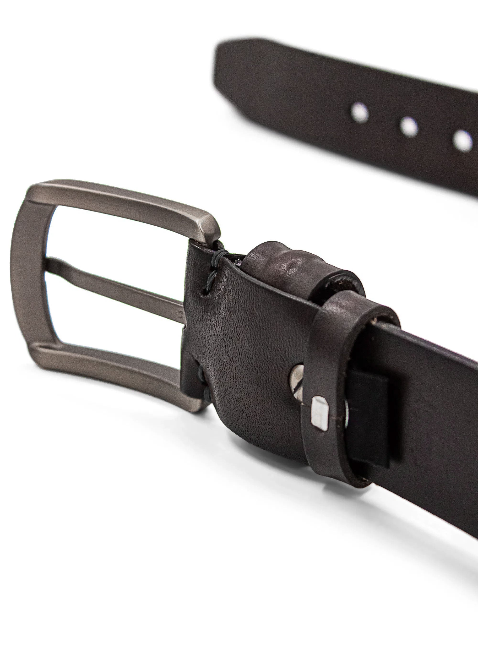 Close-up of a black leather belt with a silver buckle on a white background