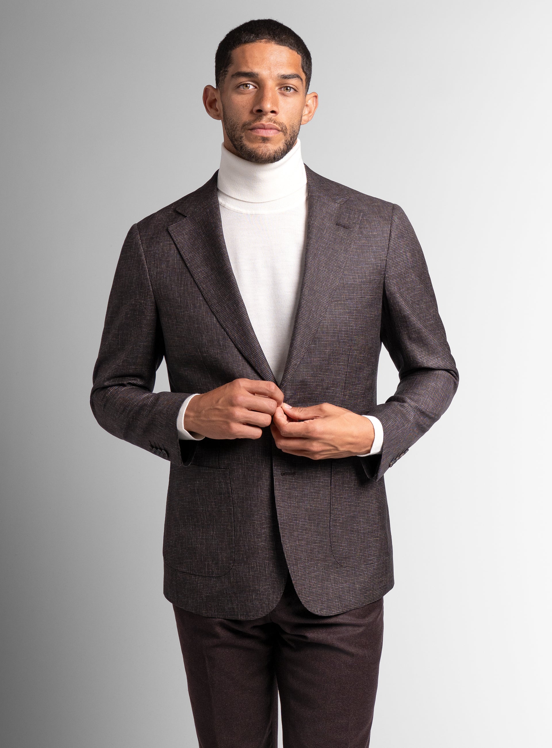 A front-view of the Mondovi Puppytooth Brown Jacket