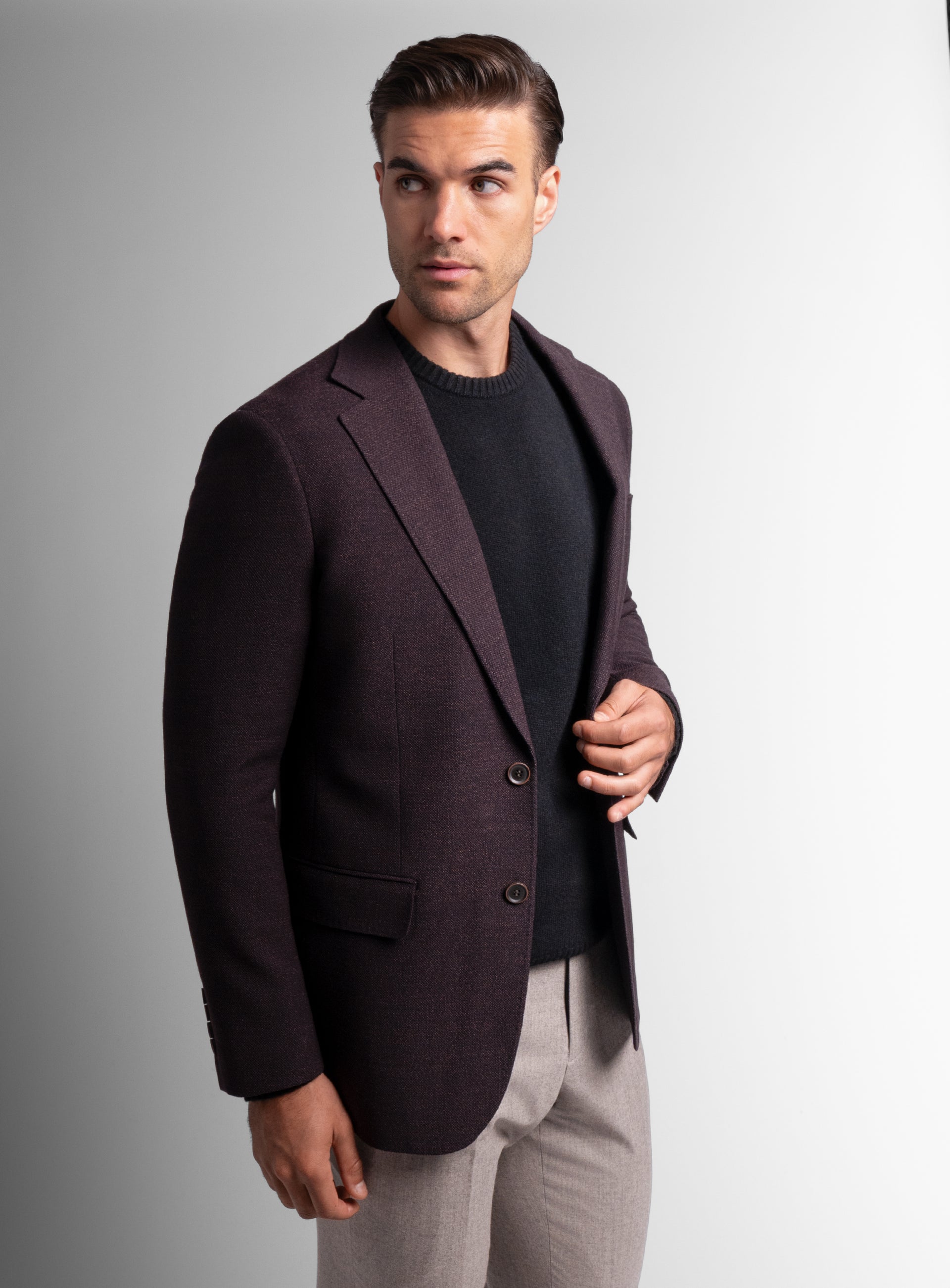 Man holding the button on the Vitale Barleycorn Mahogany Red Sport Jacket