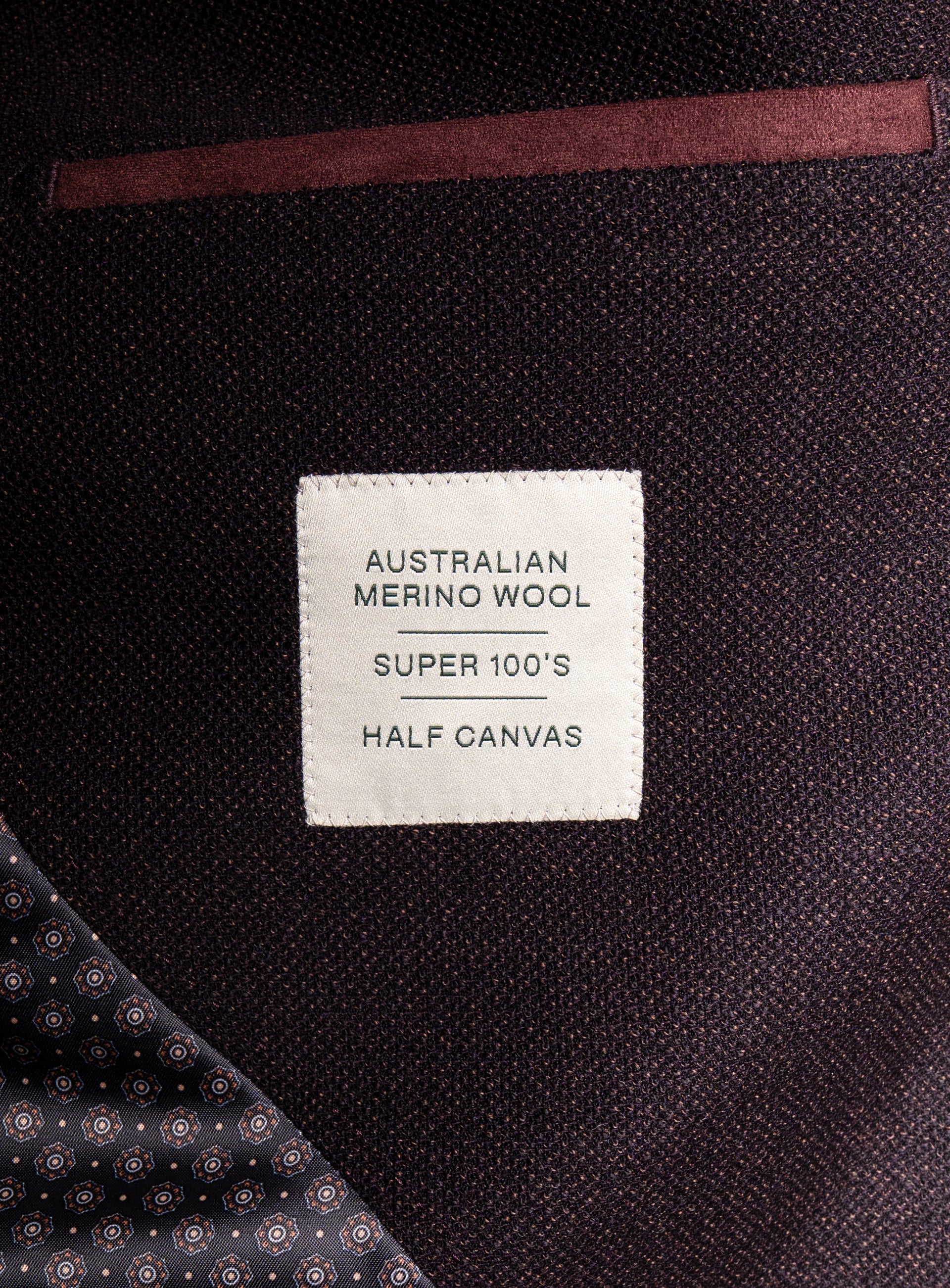 Picture of a label that says "Australian Merino Wool - Super 100's - Half Canvas" on the Vitale Barleycorn Mahogany Red Sport Jacket