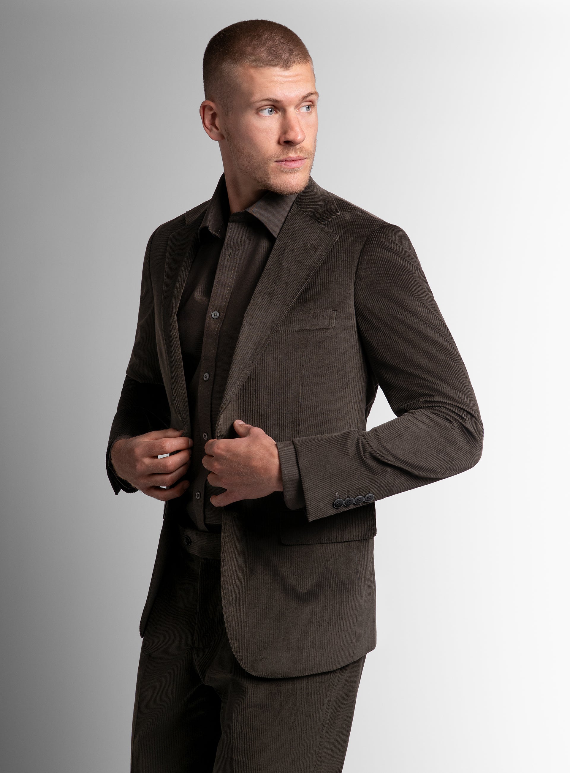 Man holding the buttons on the Vitale Corduroy Olive Green Sport Jacket