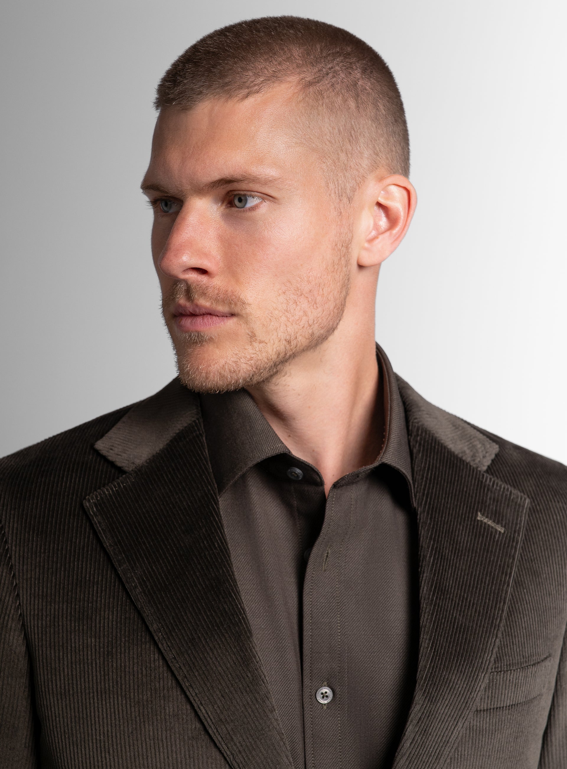Close-up of a man wearing the Vitale Corduroy Olive Green Sport Jacket