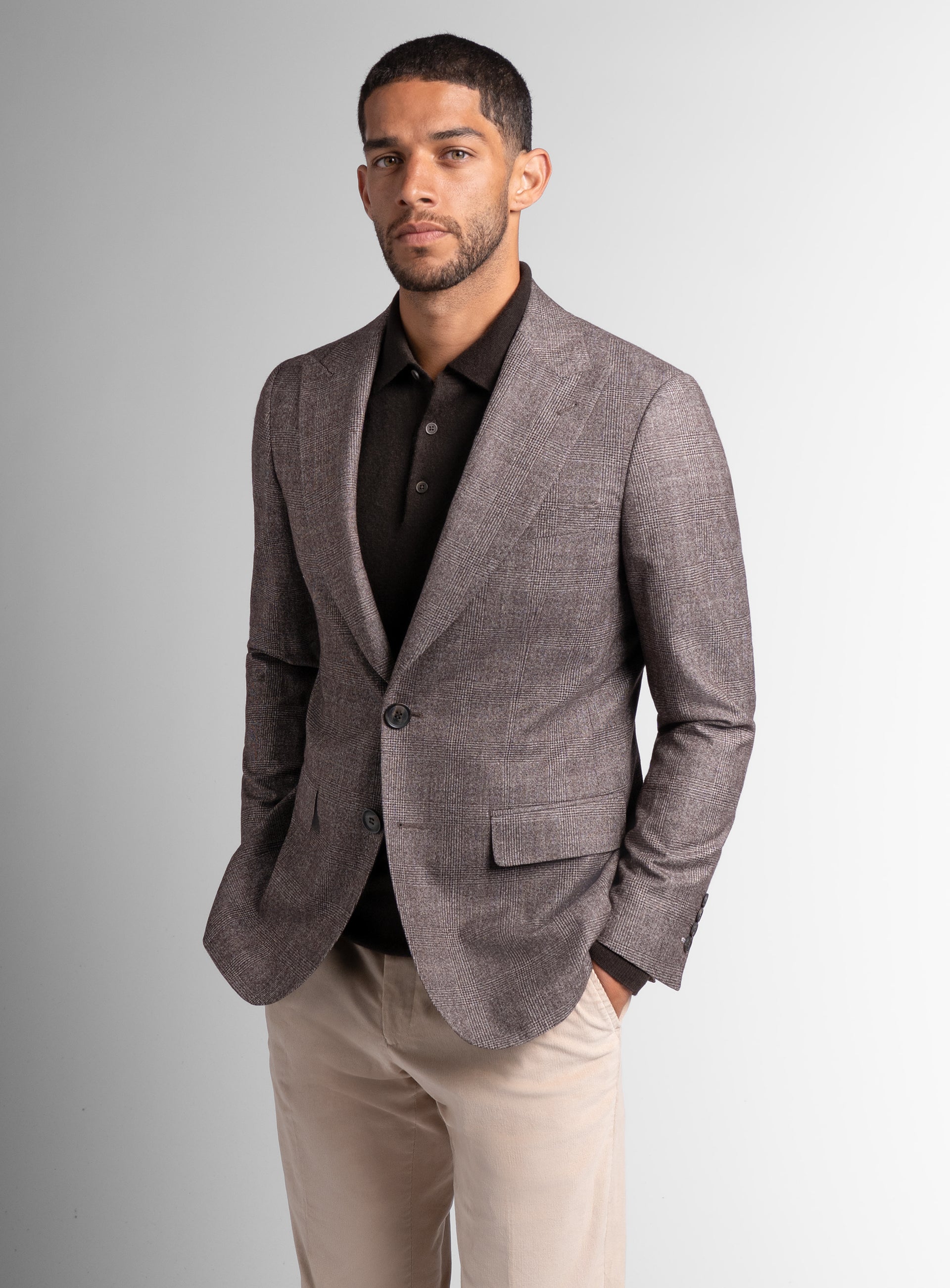 Picture of a man wearing the Portici Chocolate Brown Check Jacket with his hands in his pockets
