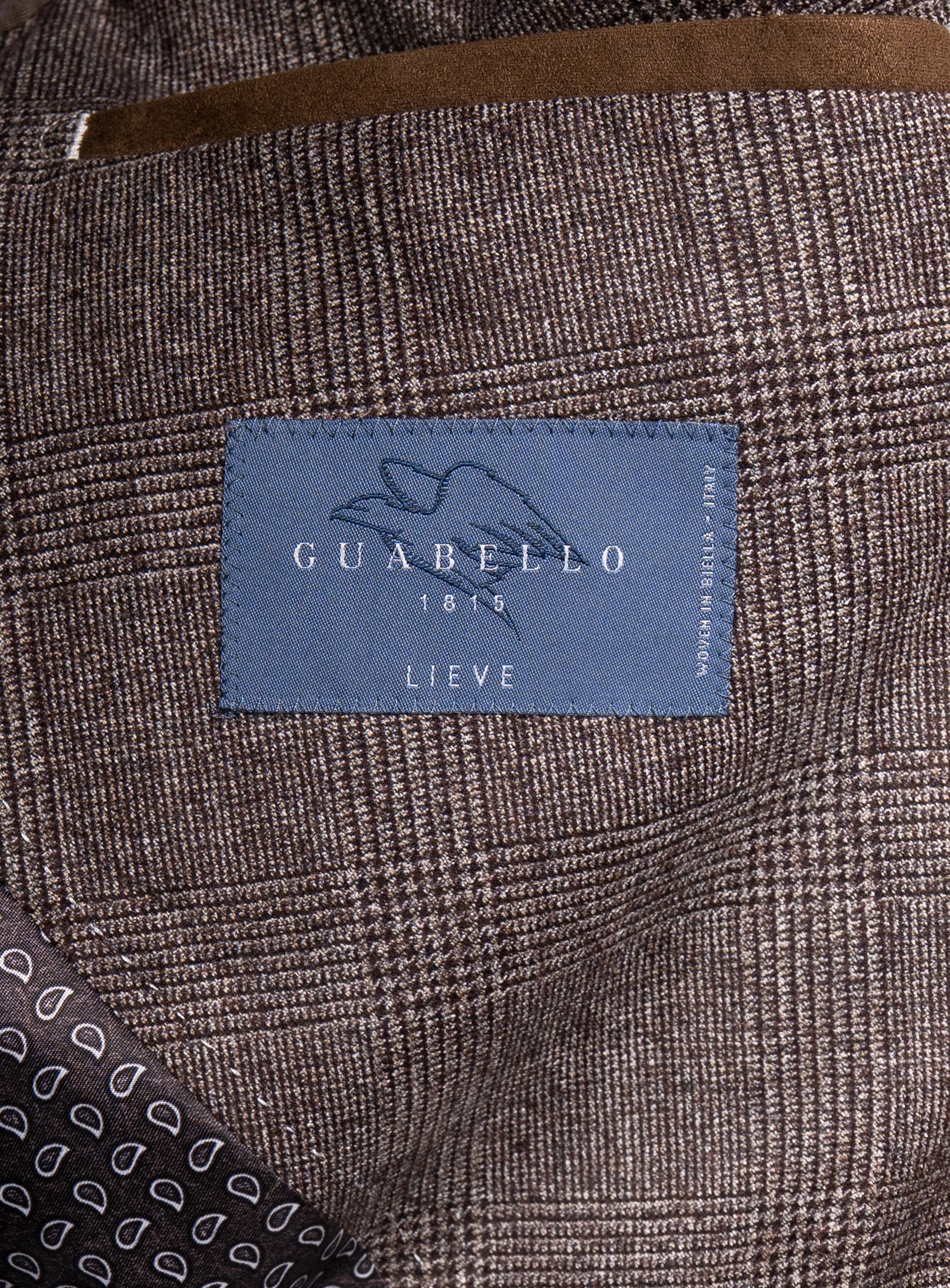 Close-up of a Guabello label on the Portici Chocolate Brown Check Jacket