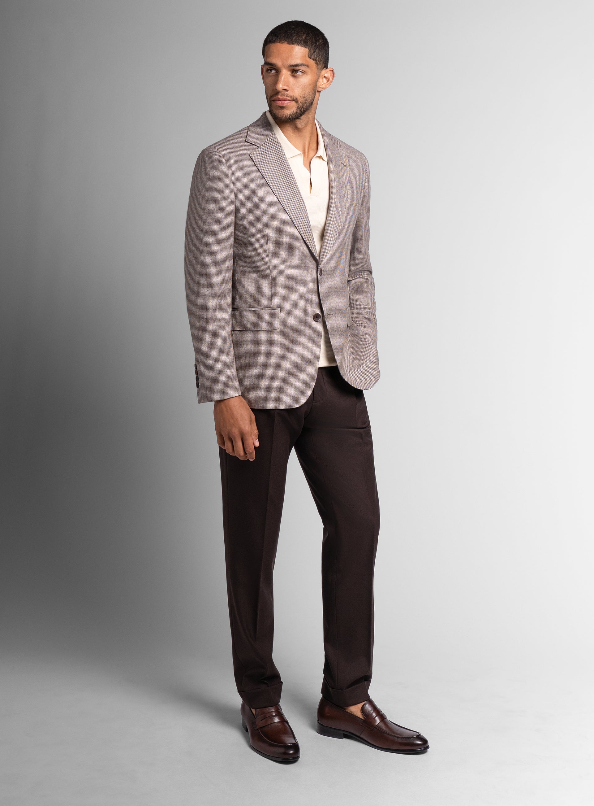 Picture of a man wearing the Vito Puppytooth Taupe Brown Jacket looking to his side