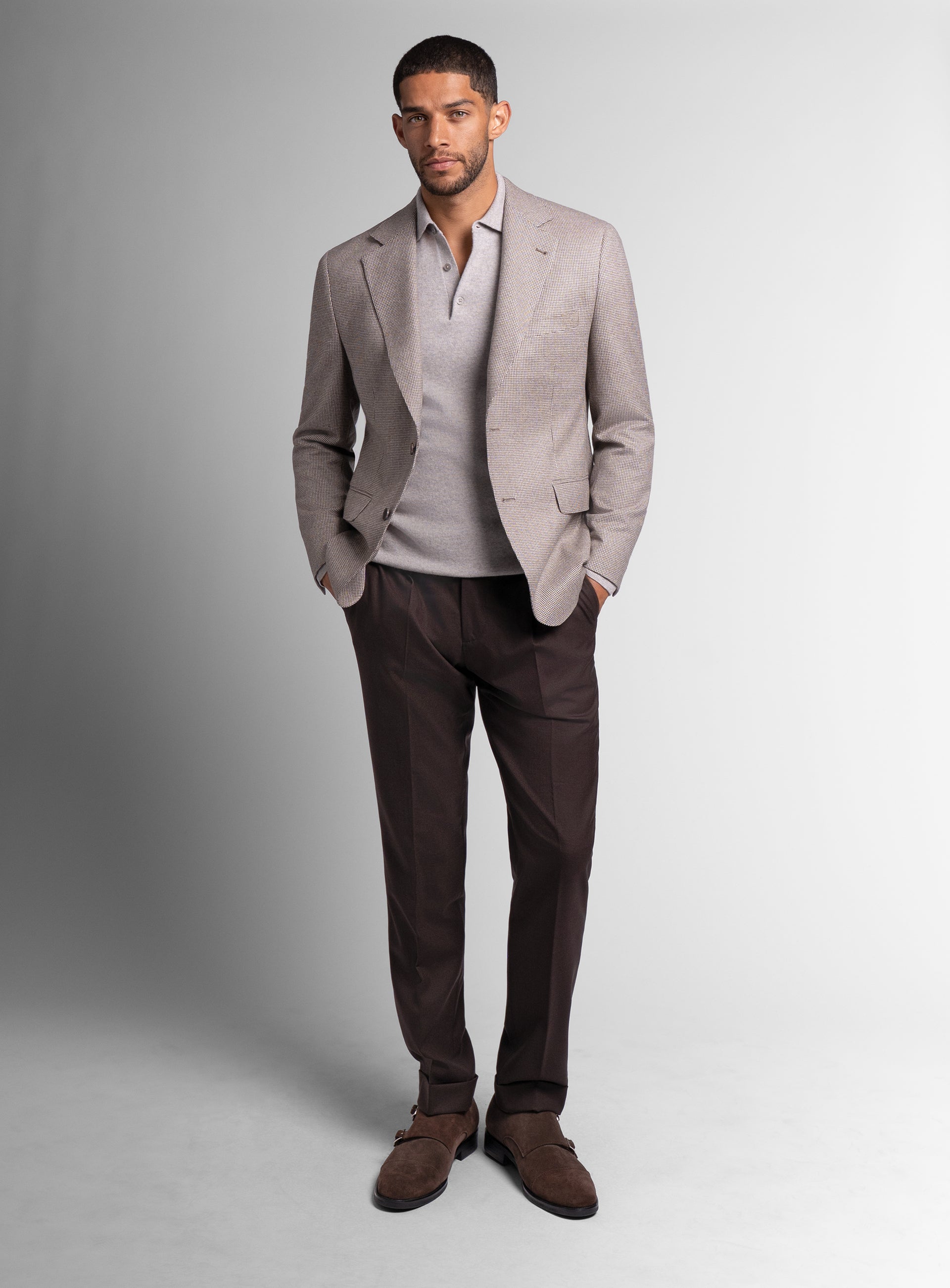 Man wearing the Vito Puppytooth Taupe Brown Jacket with his hands in his pockets