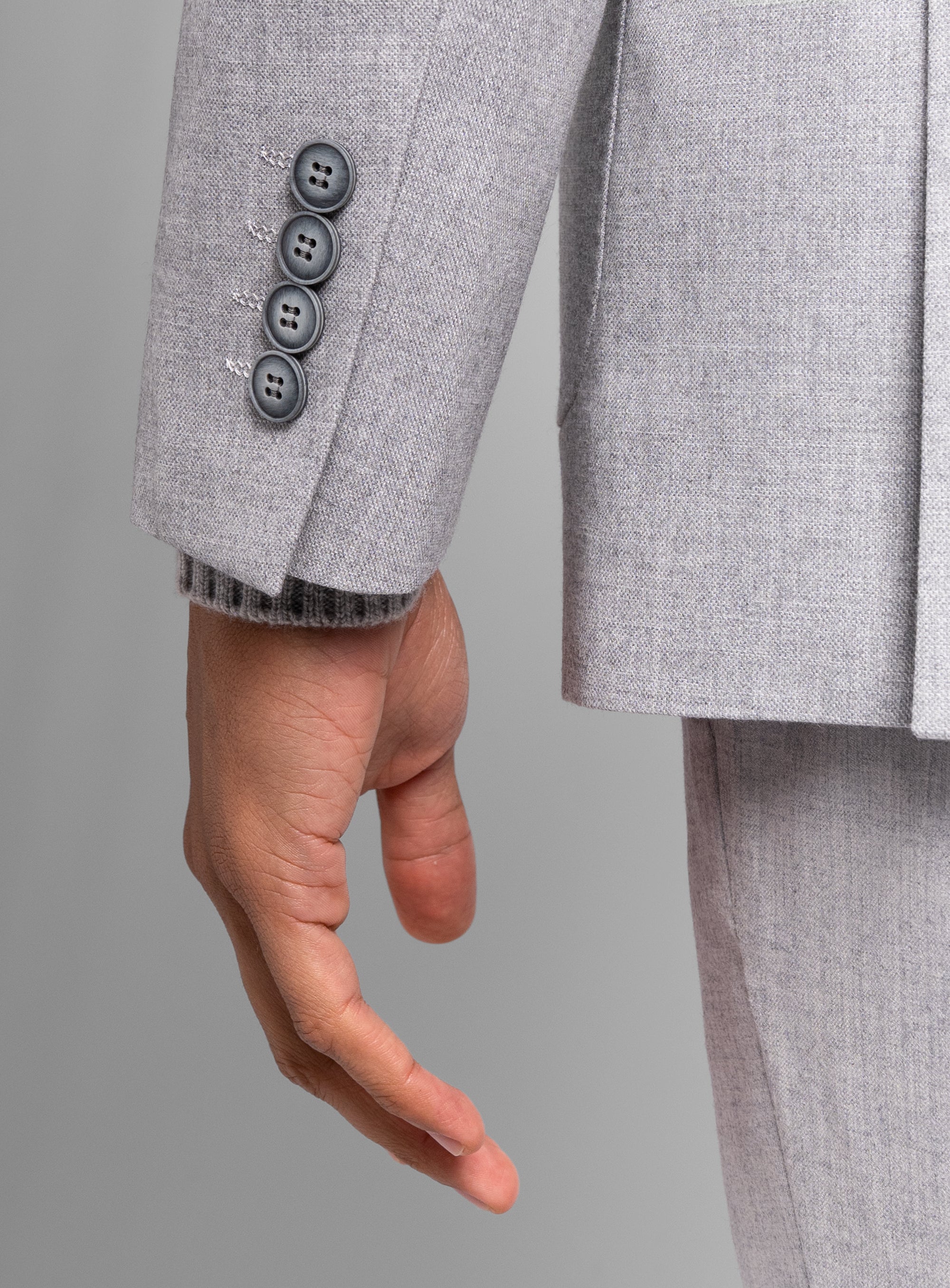 Close-up of a hand on the Mondovi Silver Milled Basketweave Jacket