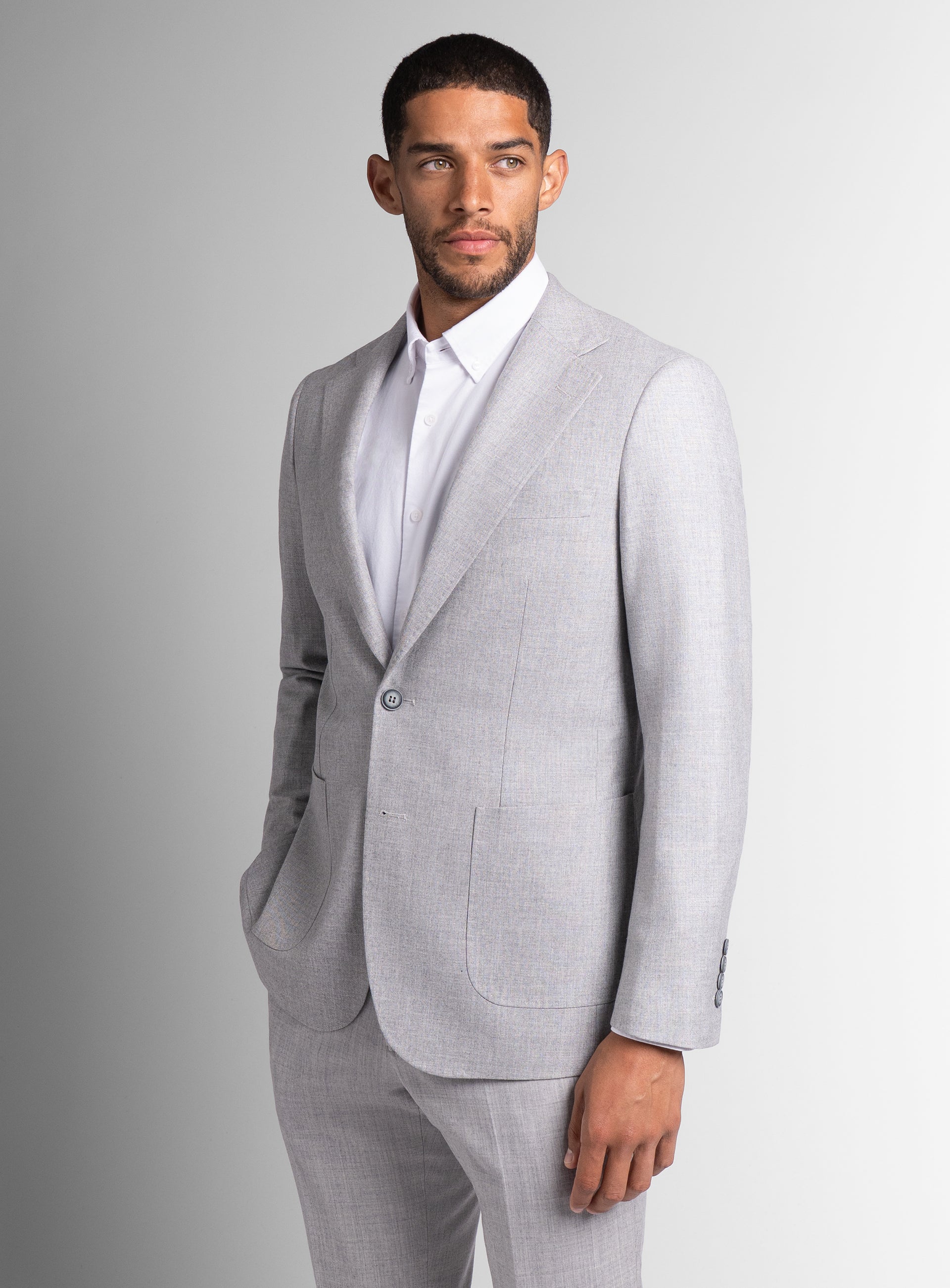 Side of a man wearing the Mondovi Silver Milled Basketweave Jacket with one hand in his pocket