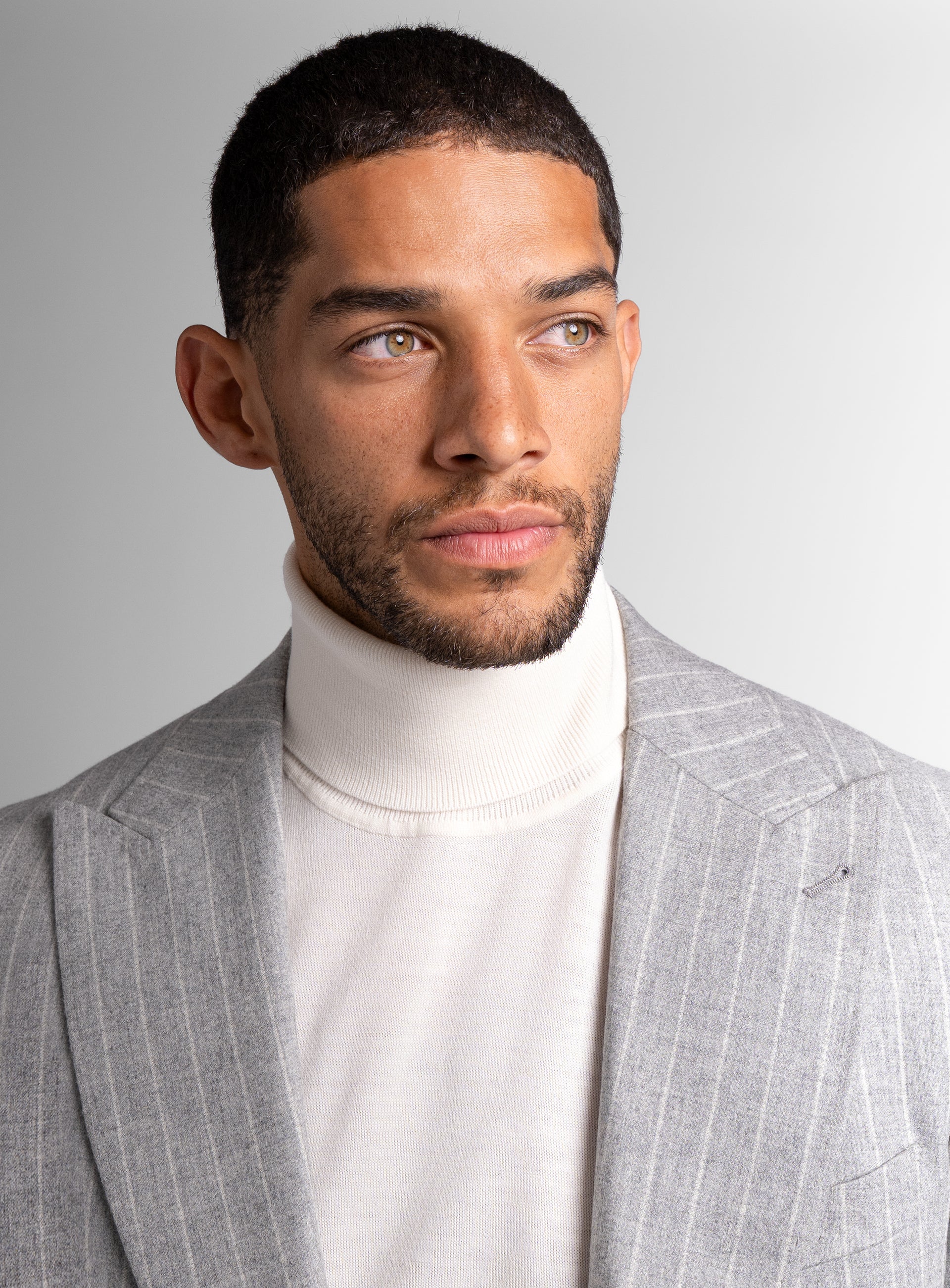 Close-up of a man wearing the Portici Milled Pinstripe Silver Grey Jacket