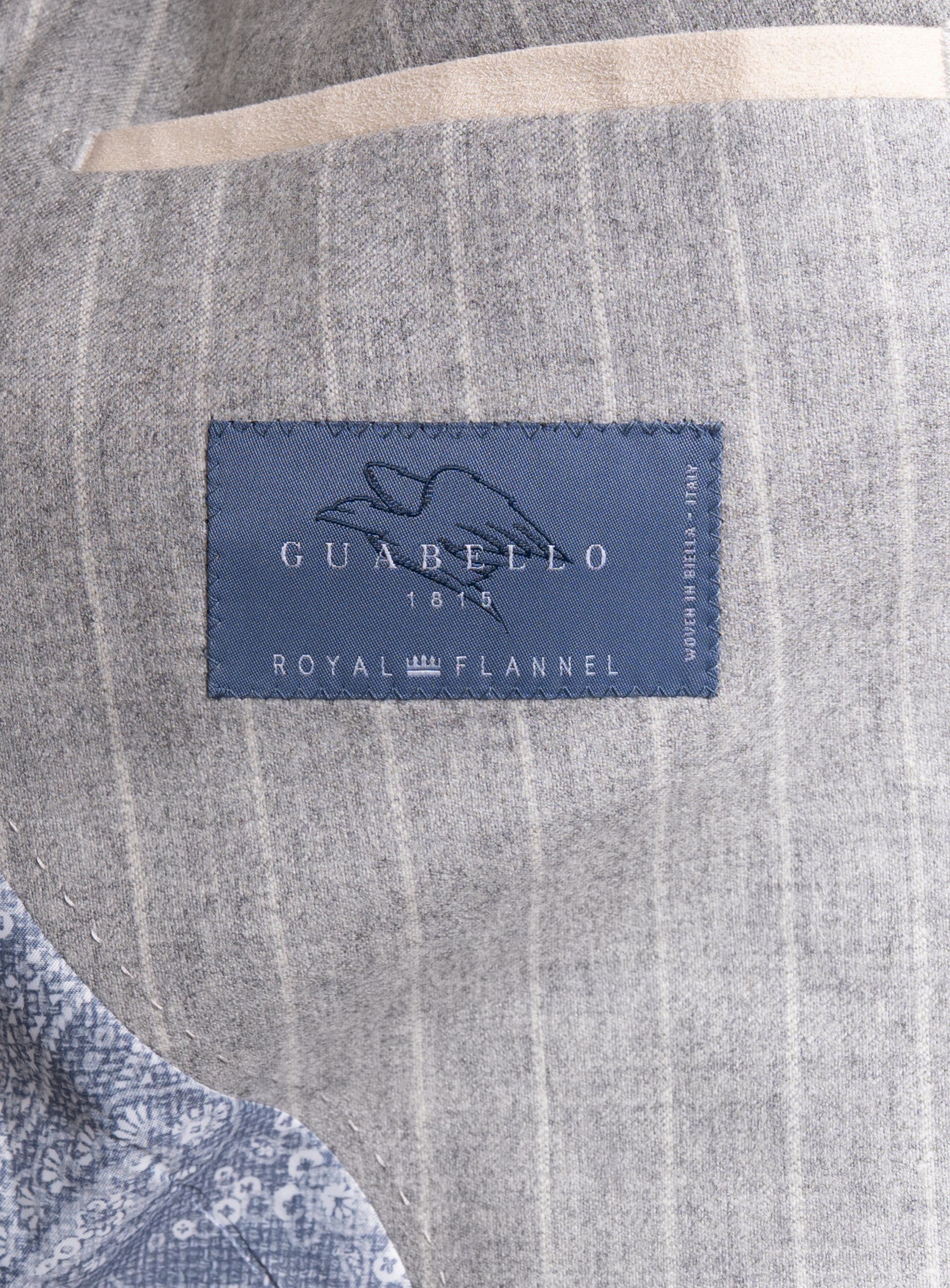 Picture of the "Royal Flannel" label on the  Portici Milled Pinstripe Silver Grey Jacket