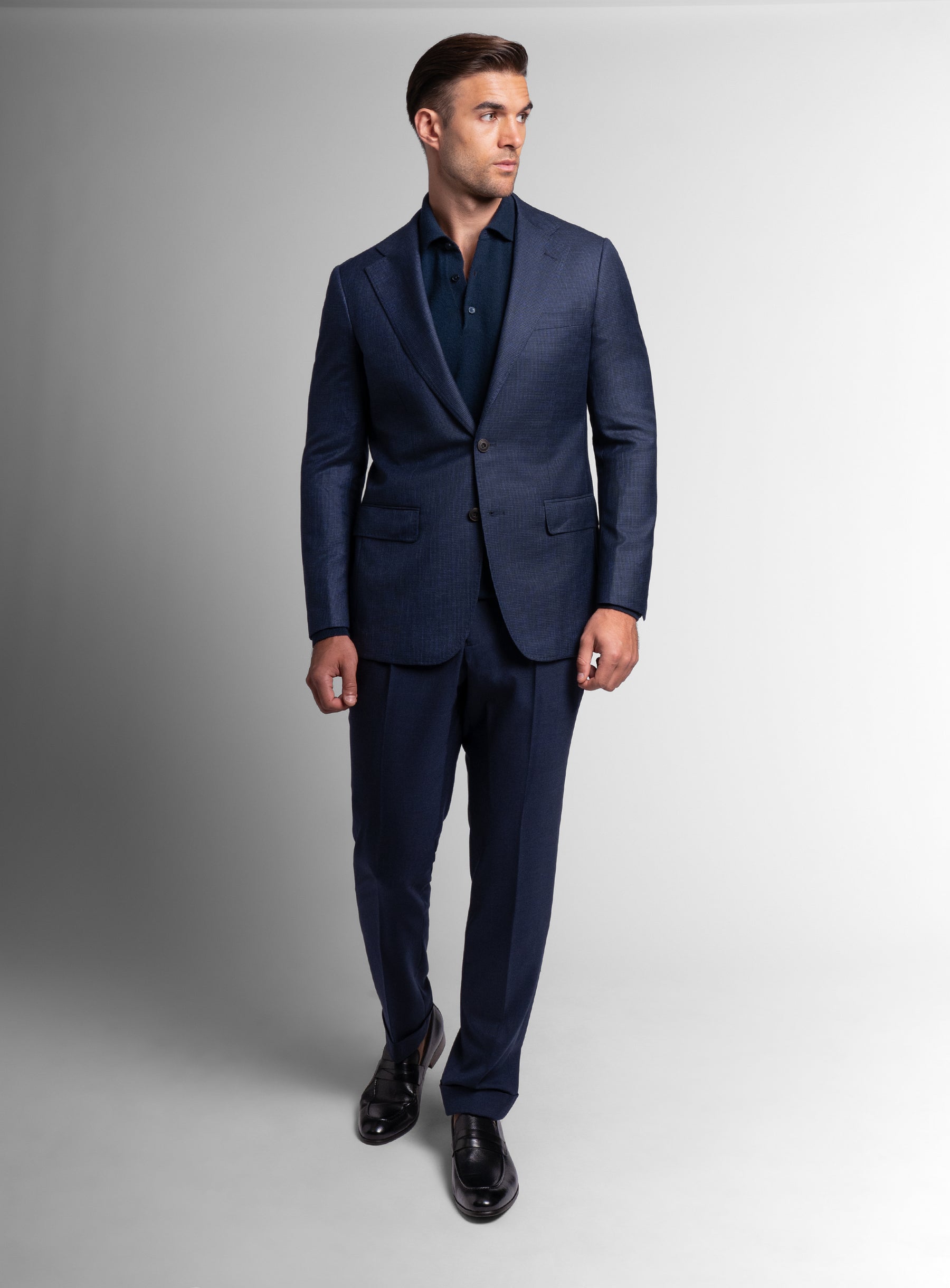 Man walking while wearing the Vitale Puppytooth Navy Sport Jacket
