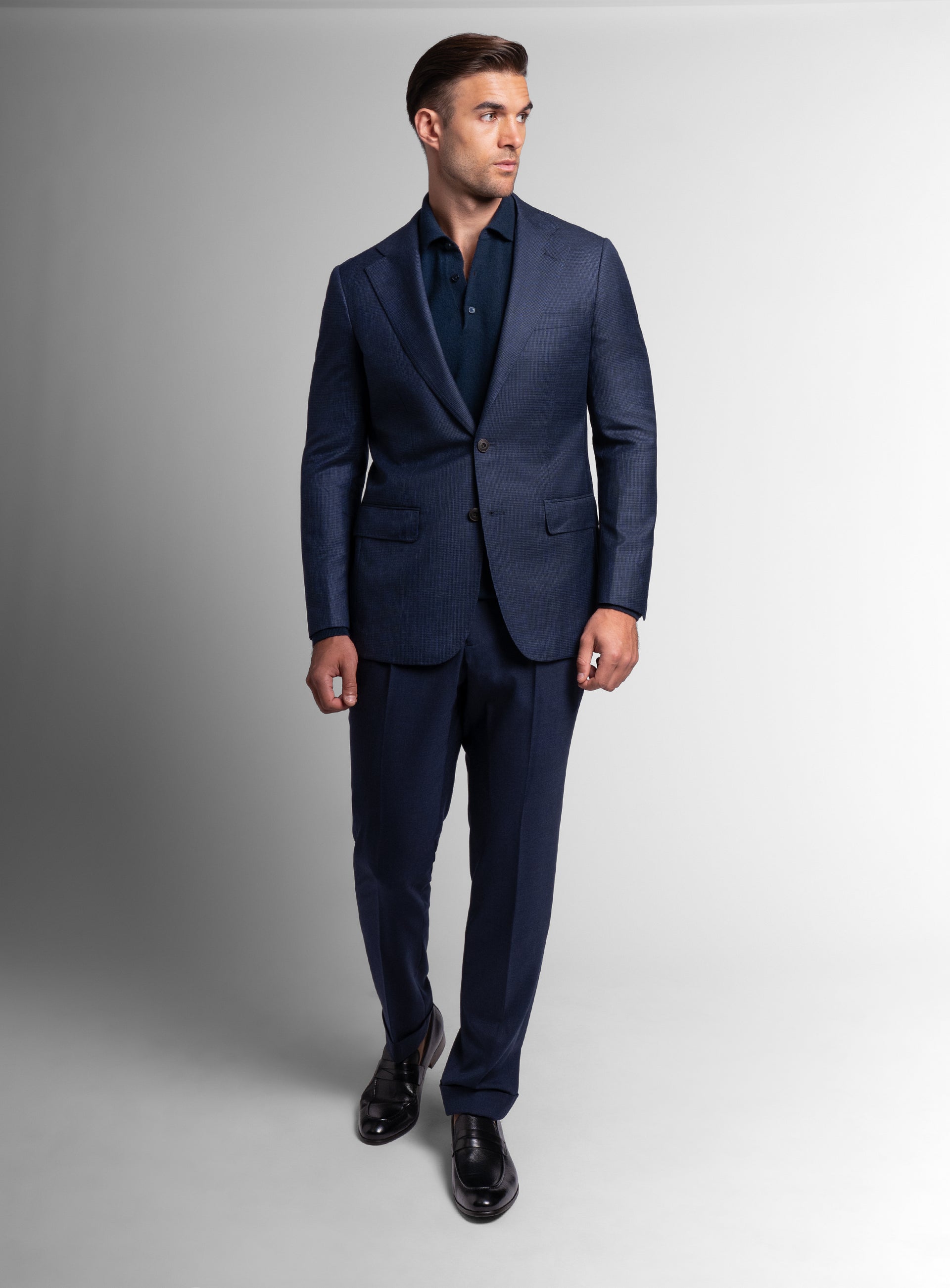 Man walking while wearing the Vitale Puppytooth Navy Sport Jacket