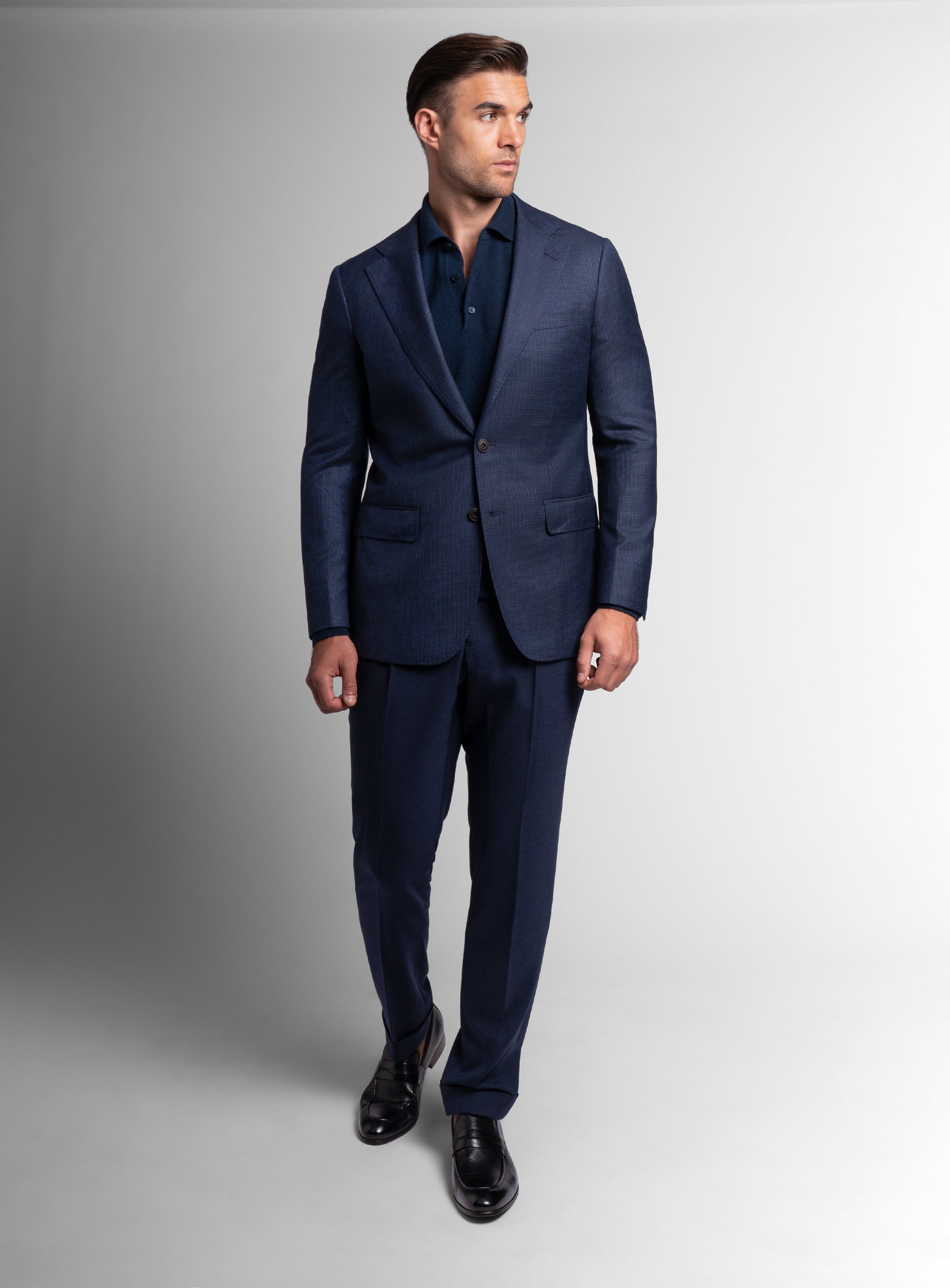 Man walking while wearing the Vitale Puppytooth Navy Sport Jacket