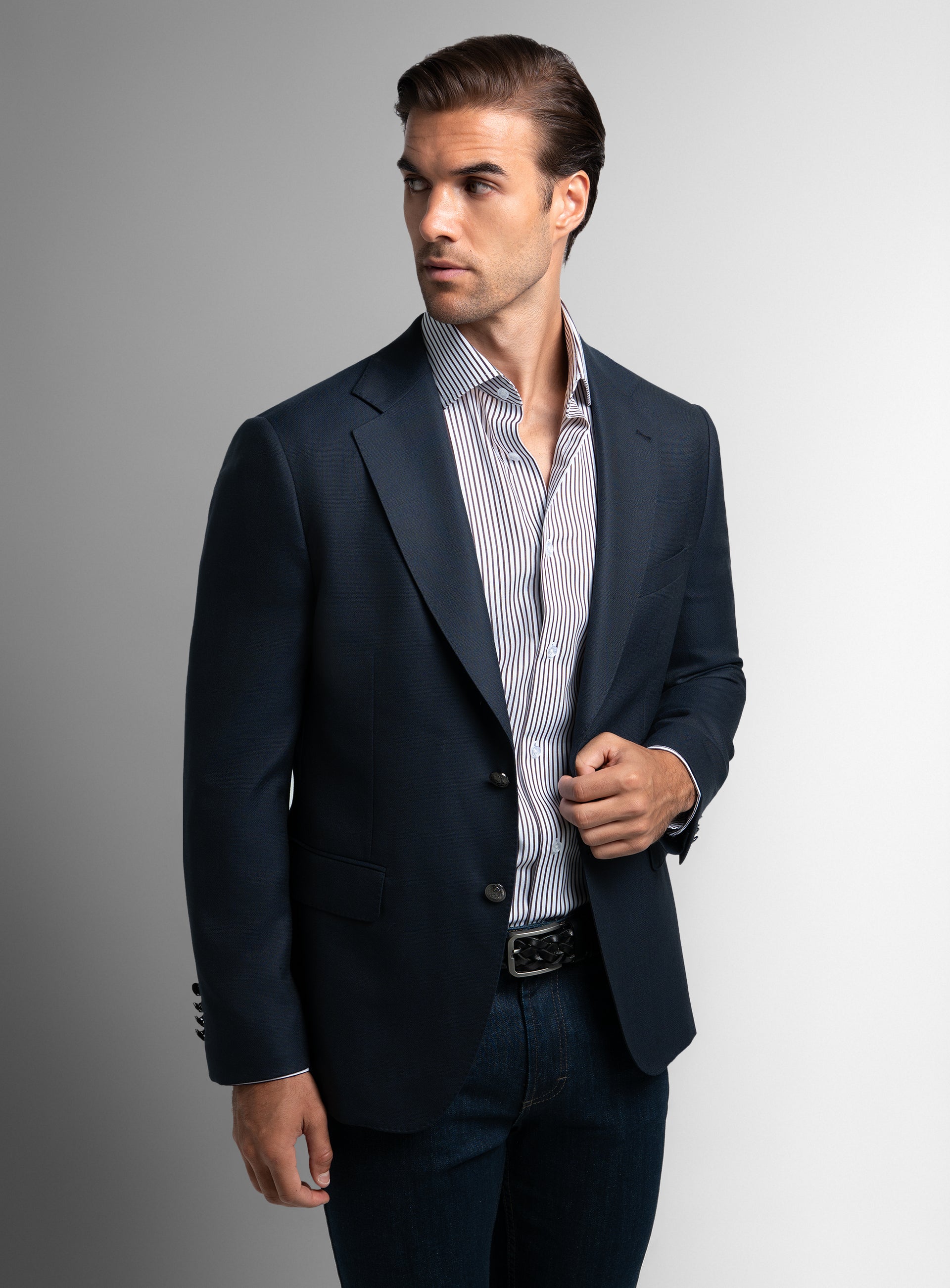 Man looking to his side wearing the Signature Wool Cashmere Navy Blazer