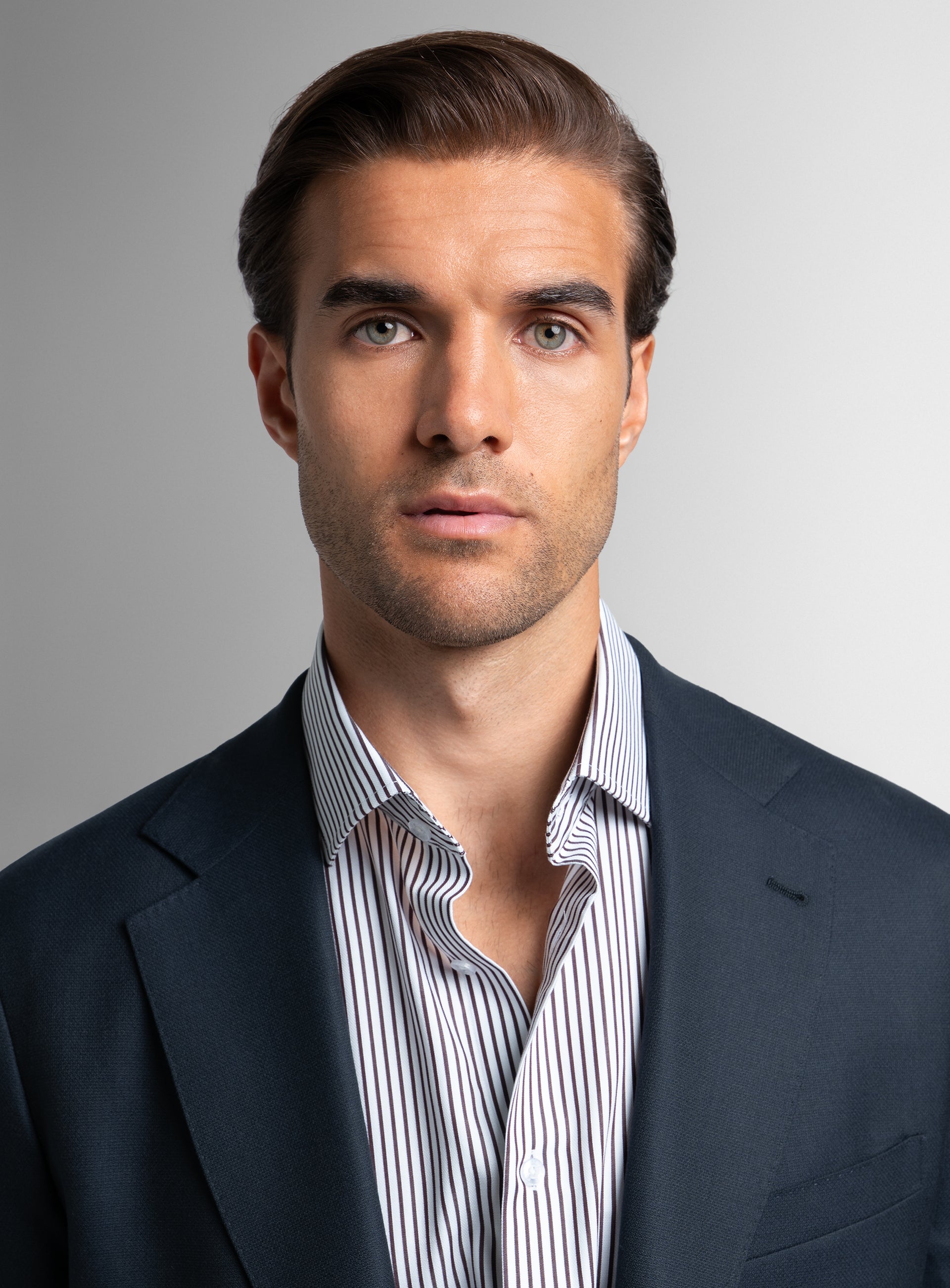 Close-up of a man wearing the Signature Wool Cashmere Navy Blazer