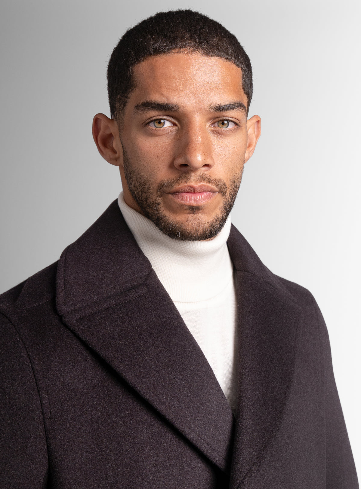 Close-up of a man wearing the Bridge Chocolate Brown Peacoat