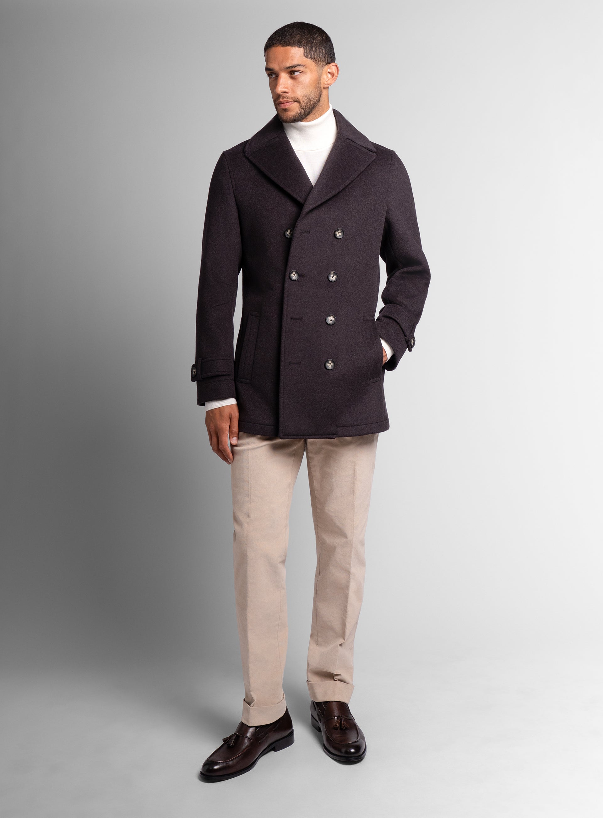 A man wearing the Bridge Chocolate Brown Peacoat