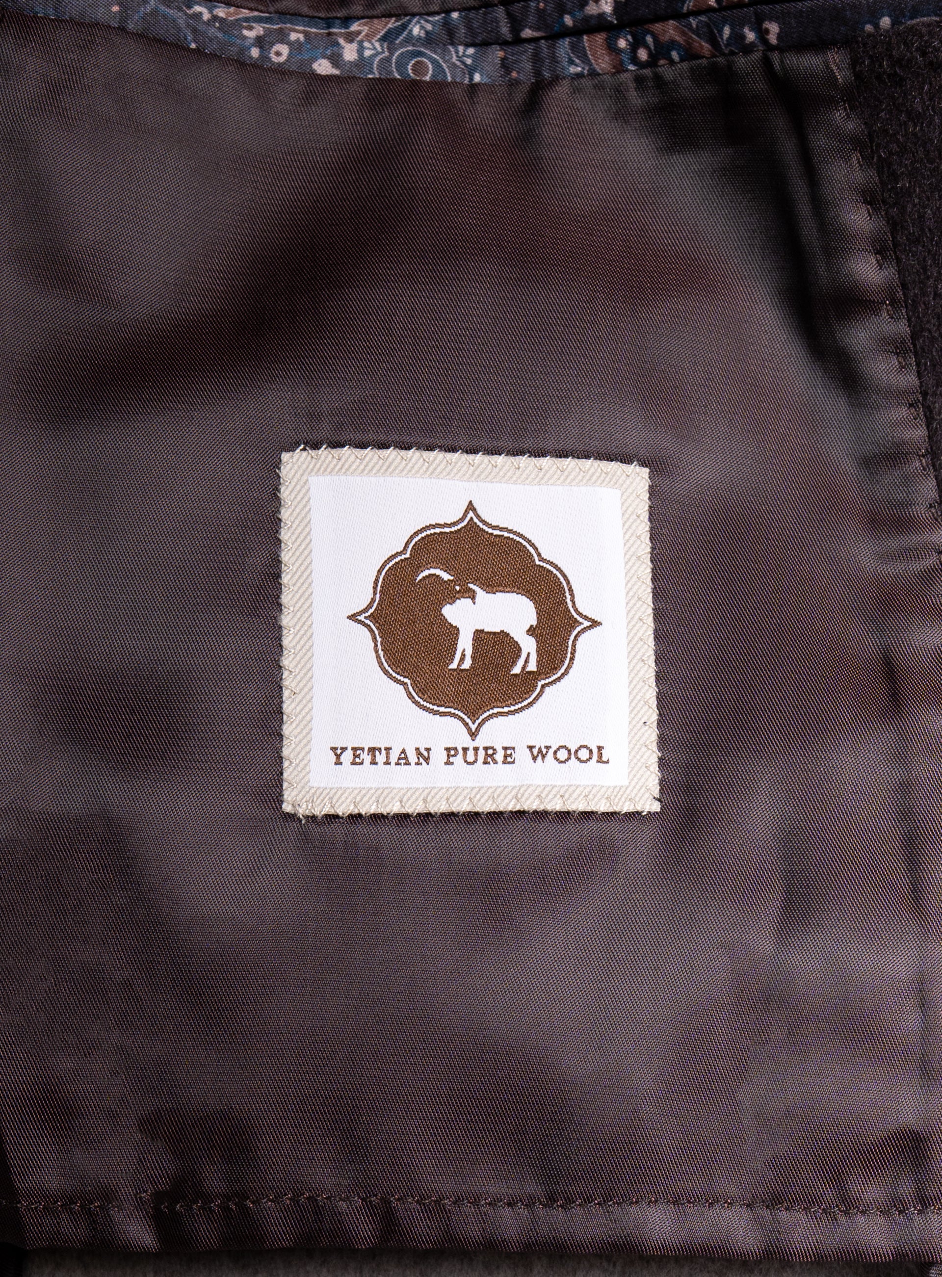 A label that says "Yetian Pure Wool" on the Bridge Chocolate Brown Peacoat