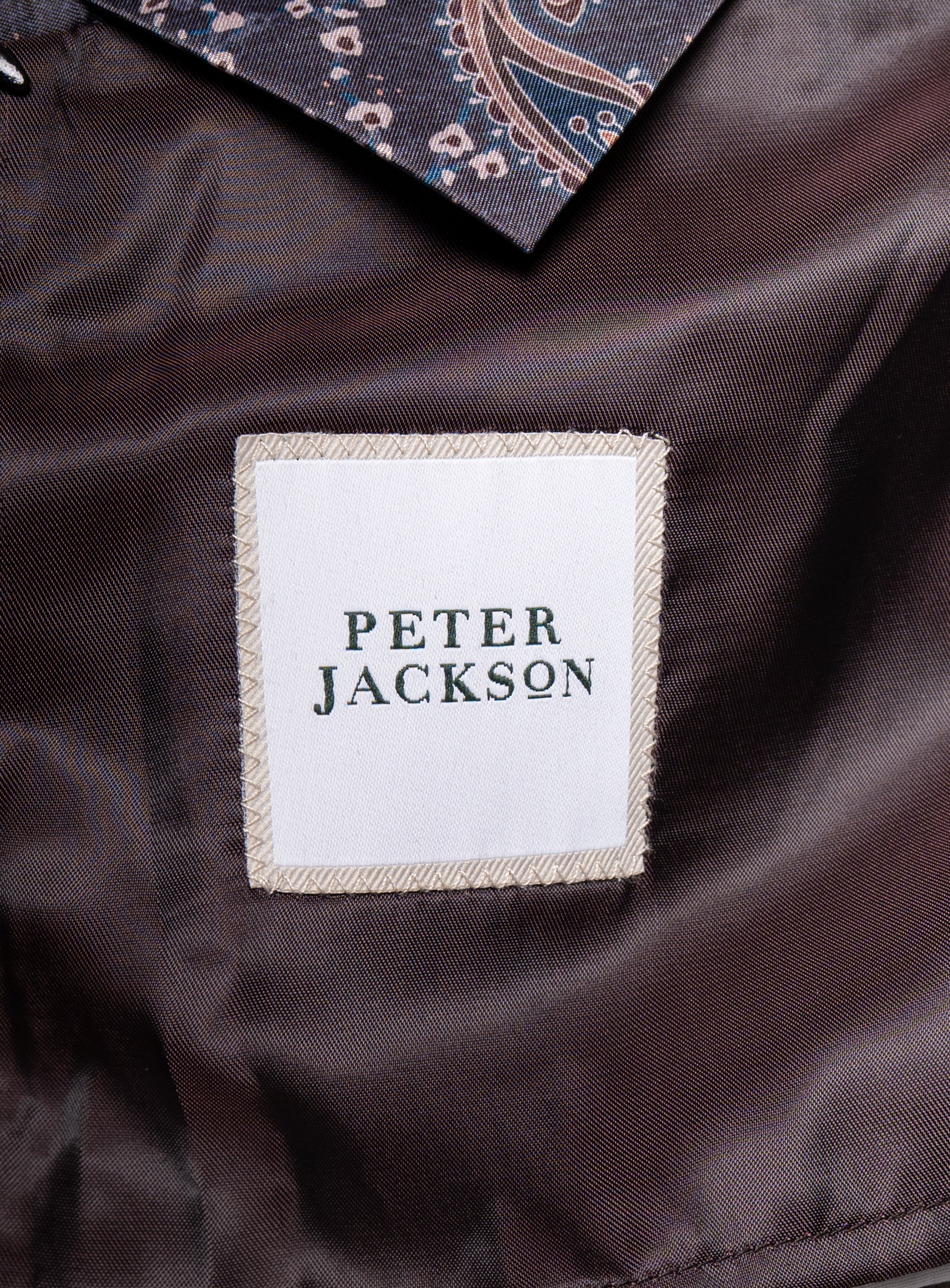 The "Peter Jackson" logo on the Bridge Chocolate Brown Peacoat