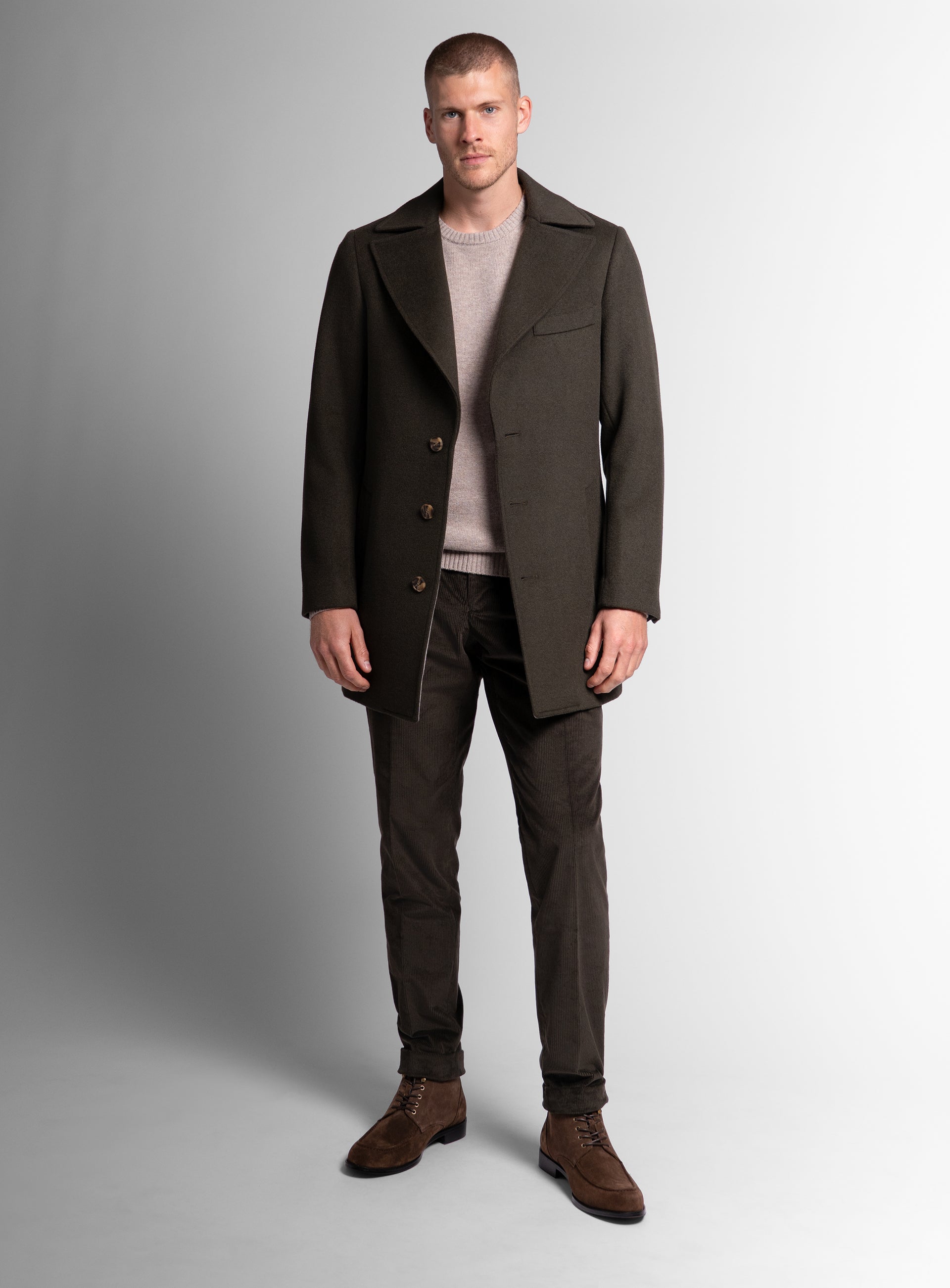A man wearing the Gallio Wool Pile Forest Green Coat