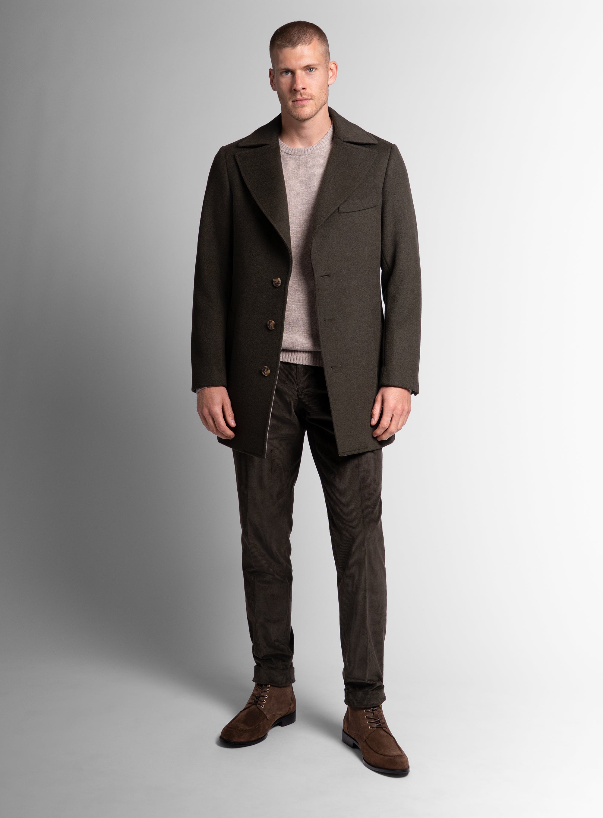 A man wearing the Gallio Wool Pile Forest Green Coat