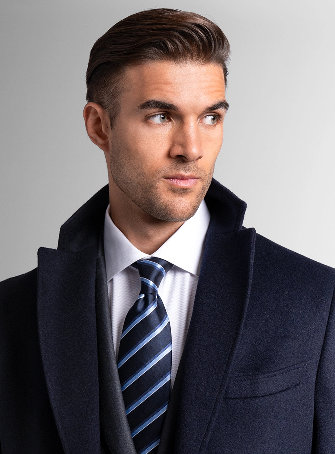 Close-up of a man wearing the Signature Wool Pile Navy Blue Coat