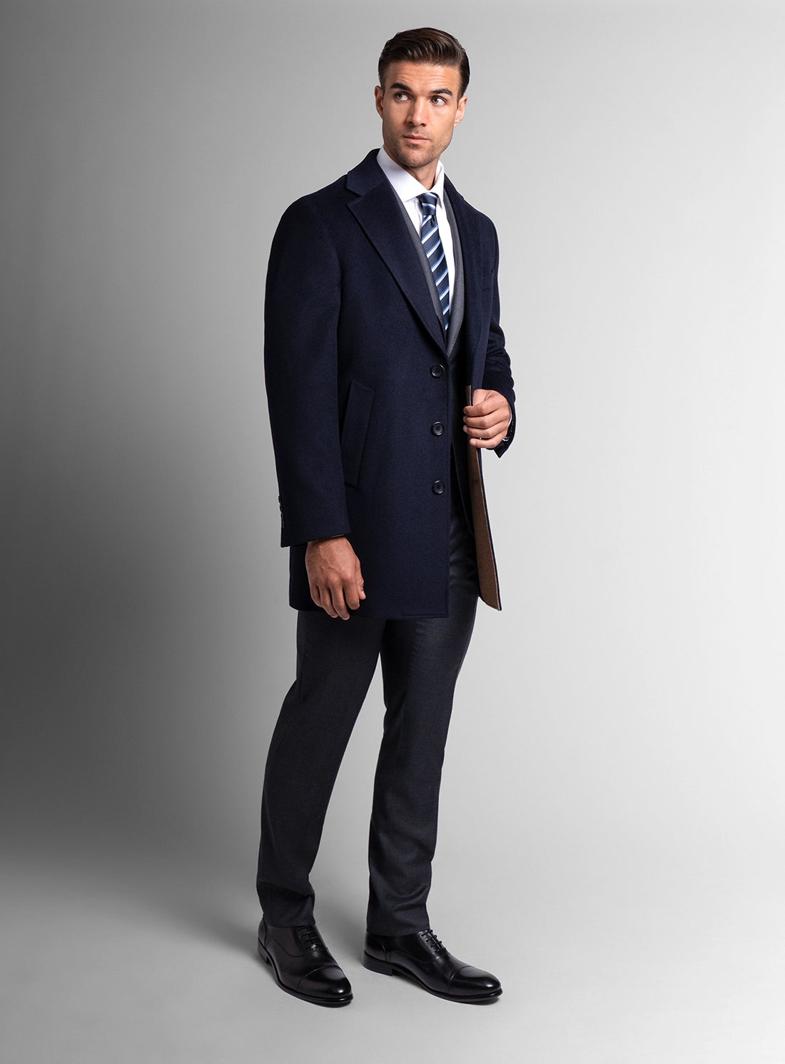 A man wearing the Signature Wool Pile Navy Blue Coat