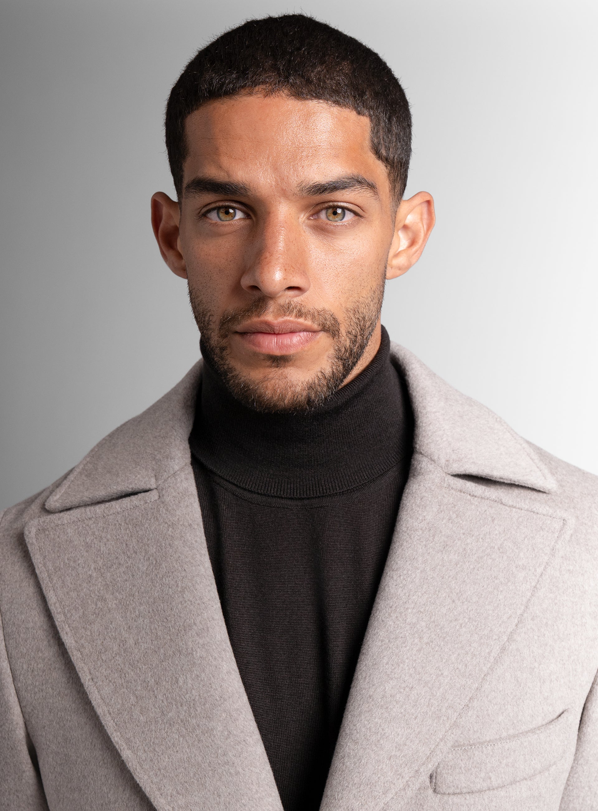 Close-up of a man wearing the Gallio Wool Pile Oat Beige Coat