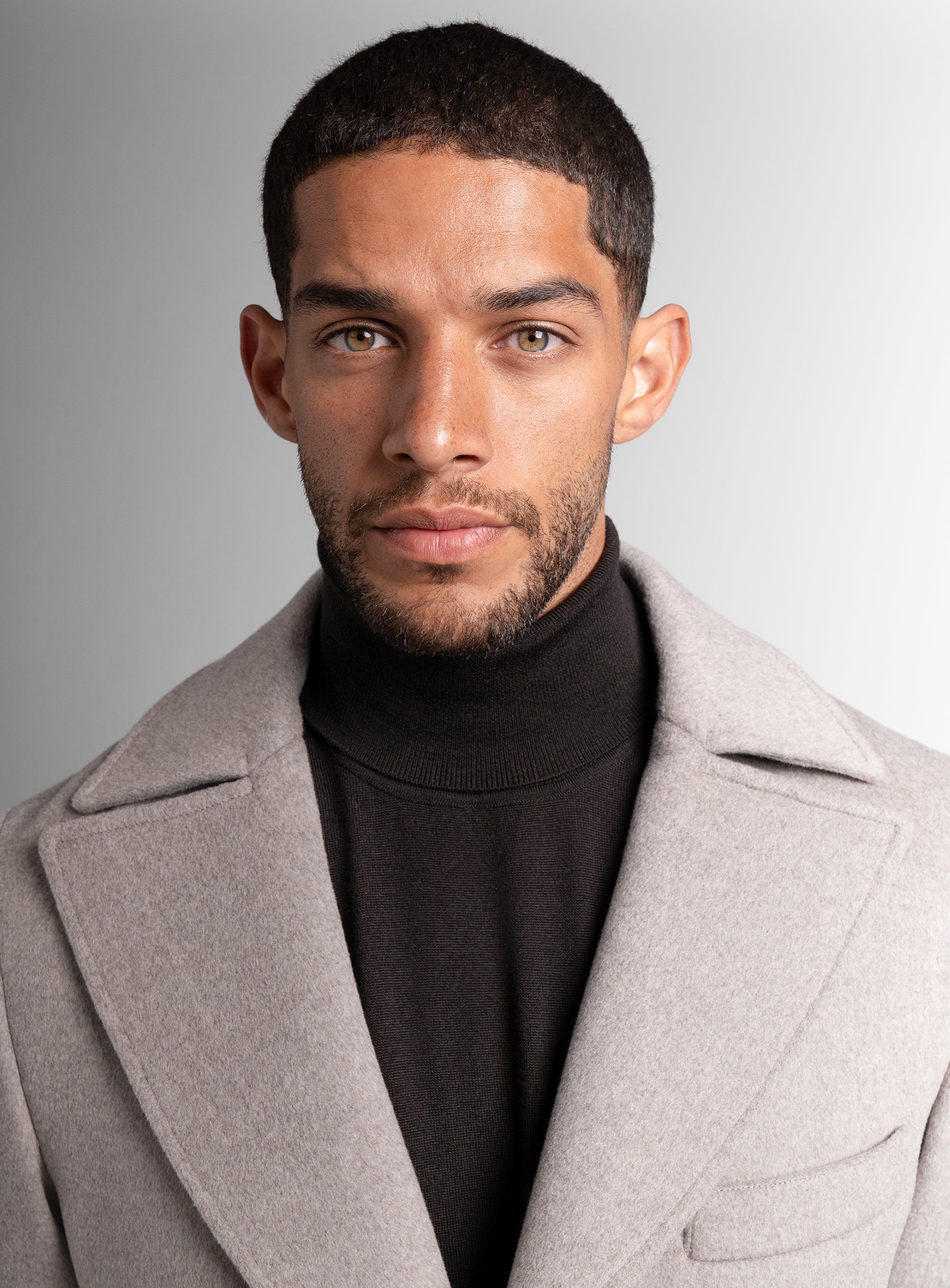 Close-up of a man wearing the Gallio Wool Pile Oat Beige Coat
