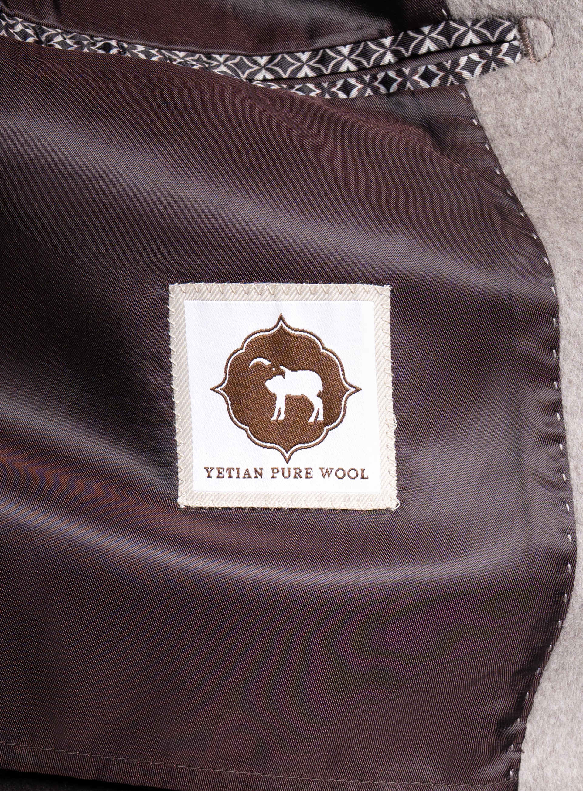 A label that says "Yetian Pure Wool" on the Gallio Wool Pile Oat Beige Coat