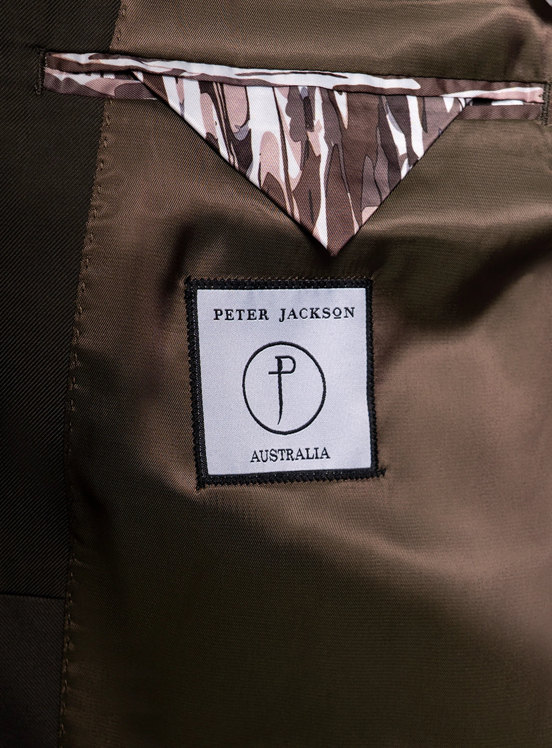Close-up of a brown fabric with a Peter Jackson Australia label.