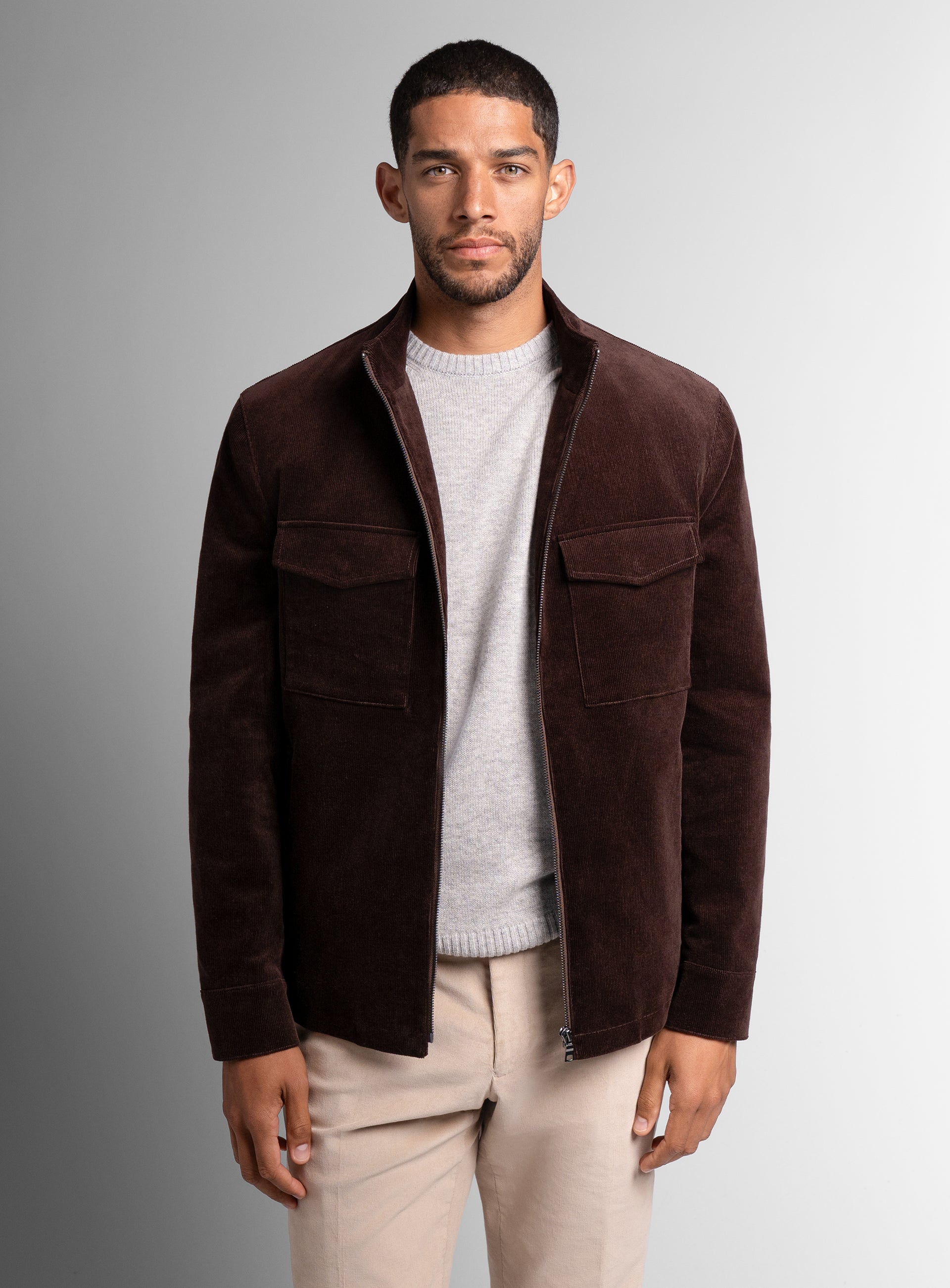 A closer view of a man wearing the Aldor Corduroy Chocolate Brown Jacket